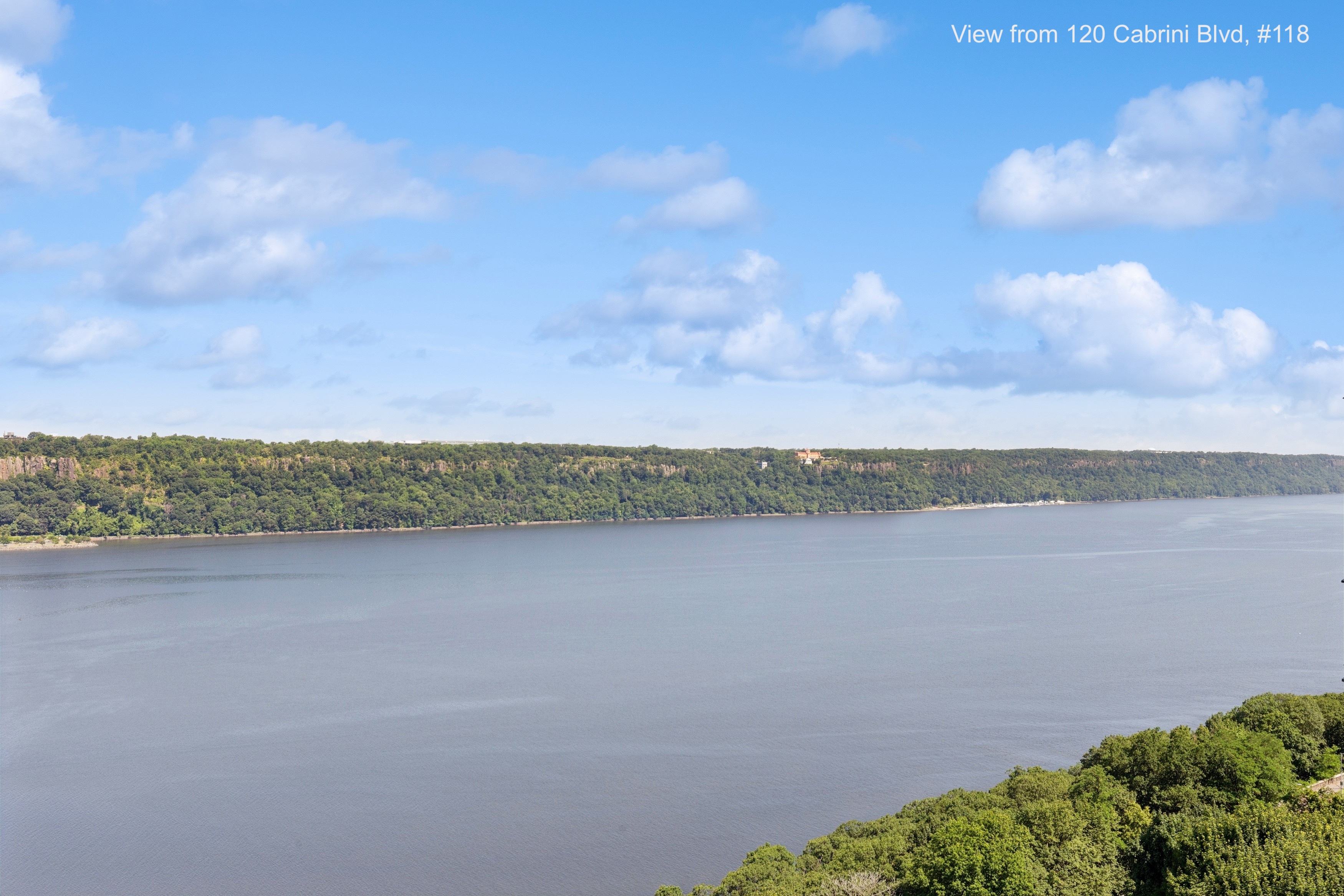 120 Cabrini Boulevard, Unit 118 Manhattan, NY 10033 - Photo 12 of 24 a view of a lake and mountain in the back
