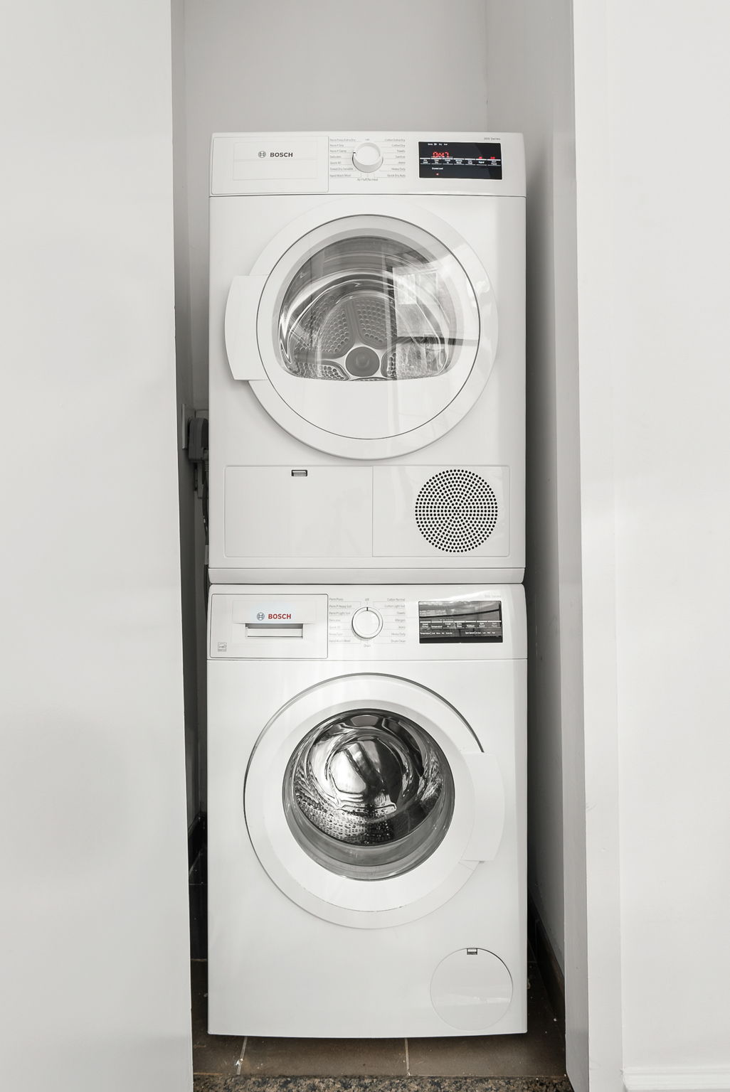 1 Wall Street Court, Unit 1405 Manhattan, NY 10005 - Photo 16 of 19 a utility room with dryer and washer