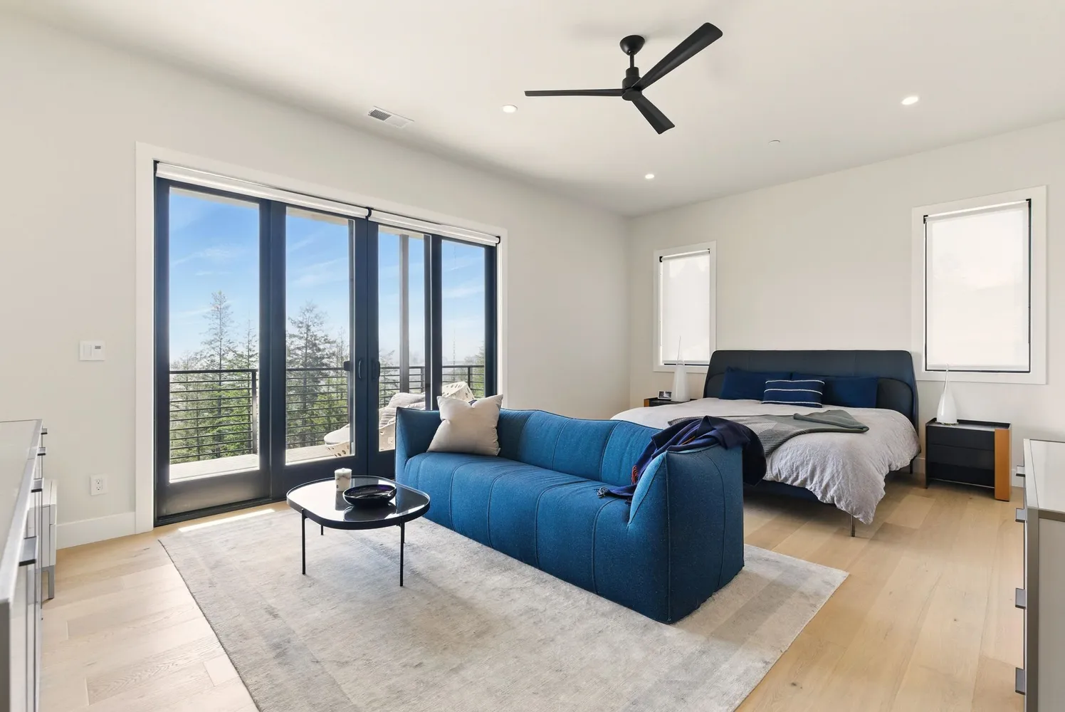 a bedroom with a bed and couch