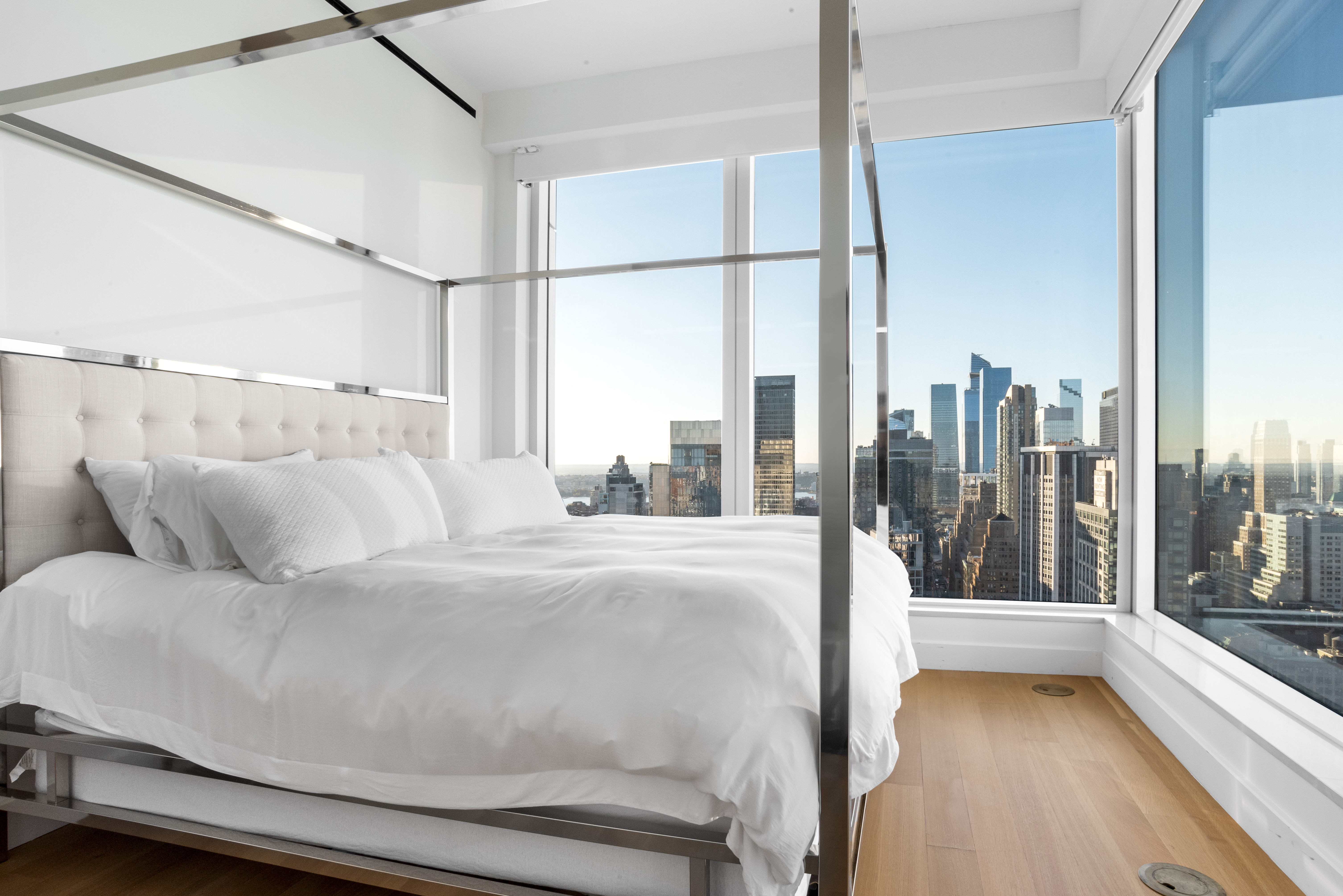 15 East 30th Street, Unit Undisclosed Manhattan, NY 10016 - Photo 9 of 23 a living room with a bed furniture and a large window