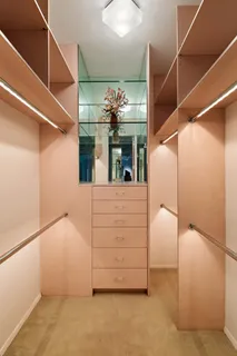 a bathroom with a granite countertop sink mirror and toilet