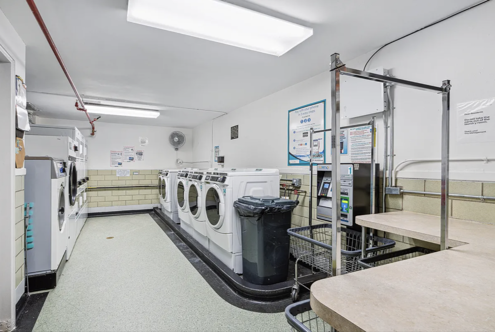 180 West Houston Street, Unit 4C Manhattan, NY 10014 - Photo 10 of 10 a utility room with multiple dryer and washer