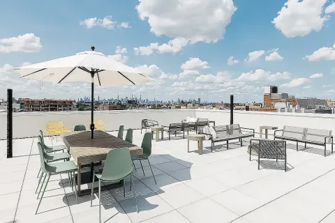 a view of a terrace with furniture