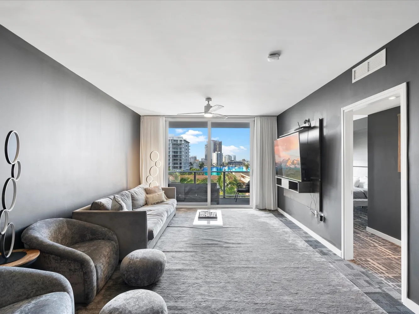 a living room with furniture and a flat screen tv