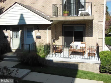 a view of house with outdoor space and porch