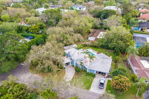 an aerial view of house with yard
