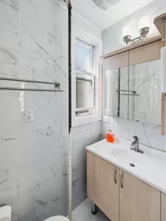 a bathroom with a sink and a window