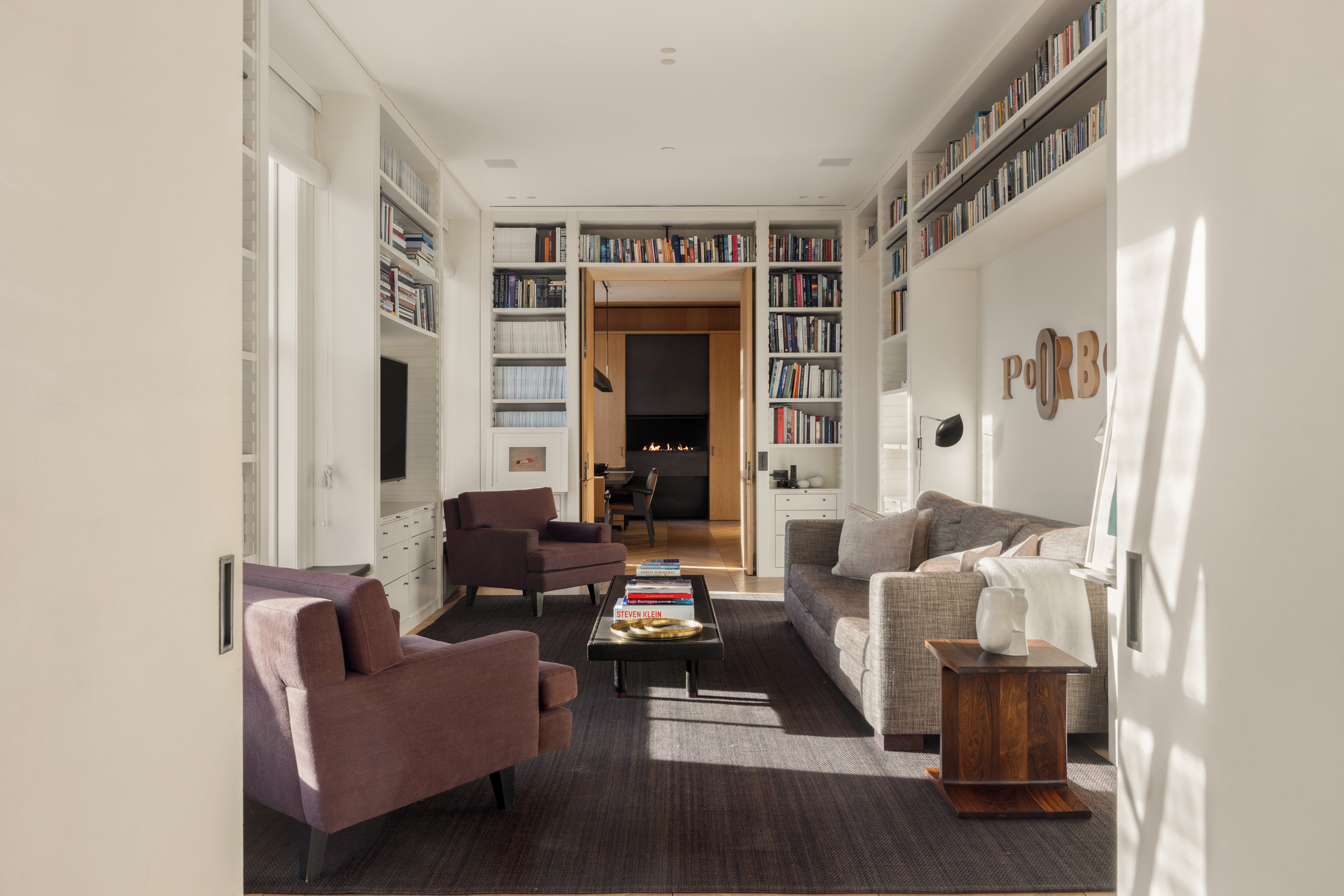 54 Bond Street, Unit PH Manhattan, NY 10012 - Photo 8 of 31 a living room with furniture and a fireplace