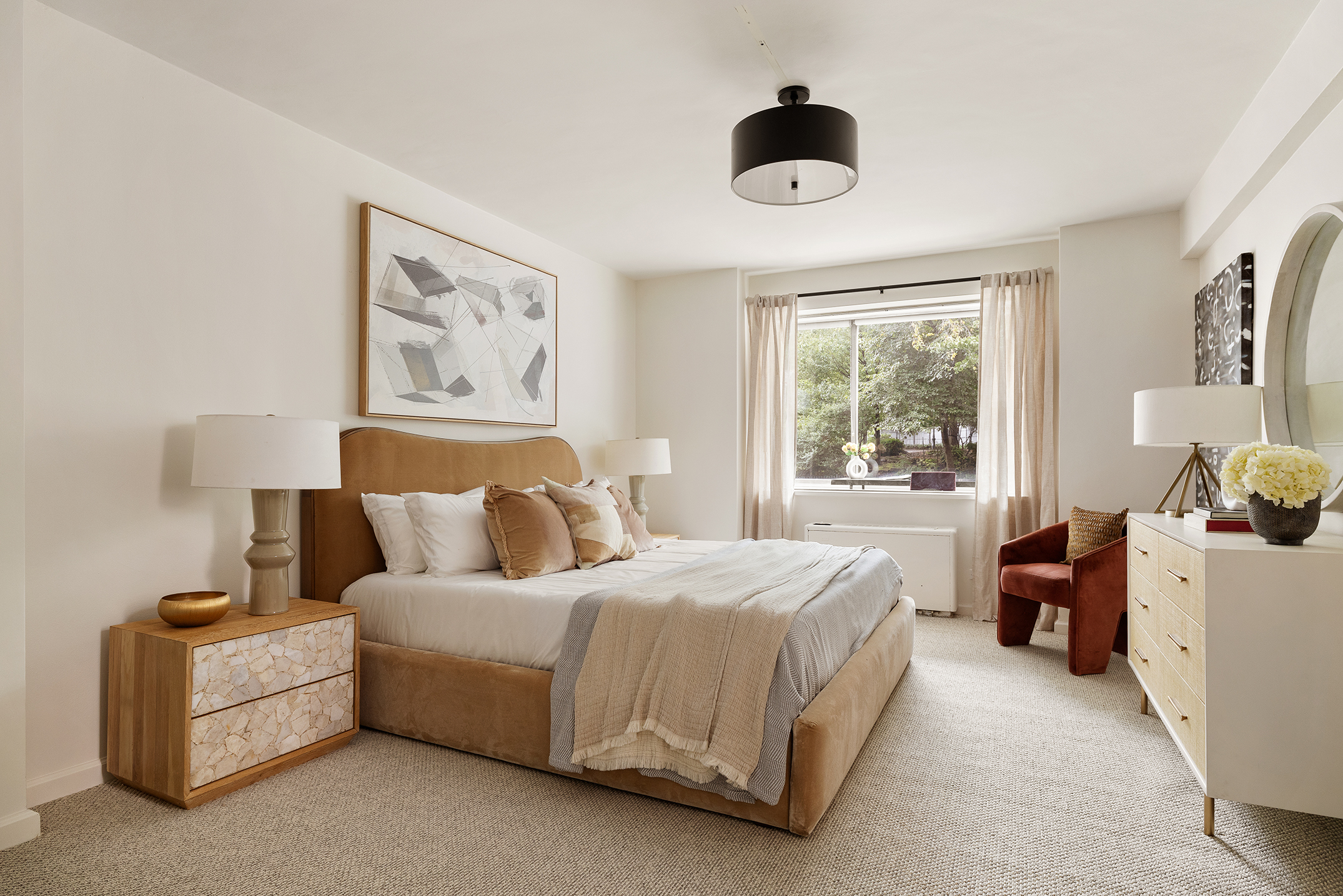 180 East End Avenue, Unit 1C Manhattan, NY 10128 - Photo 7 of 19 a bedroom with a bed and a large window