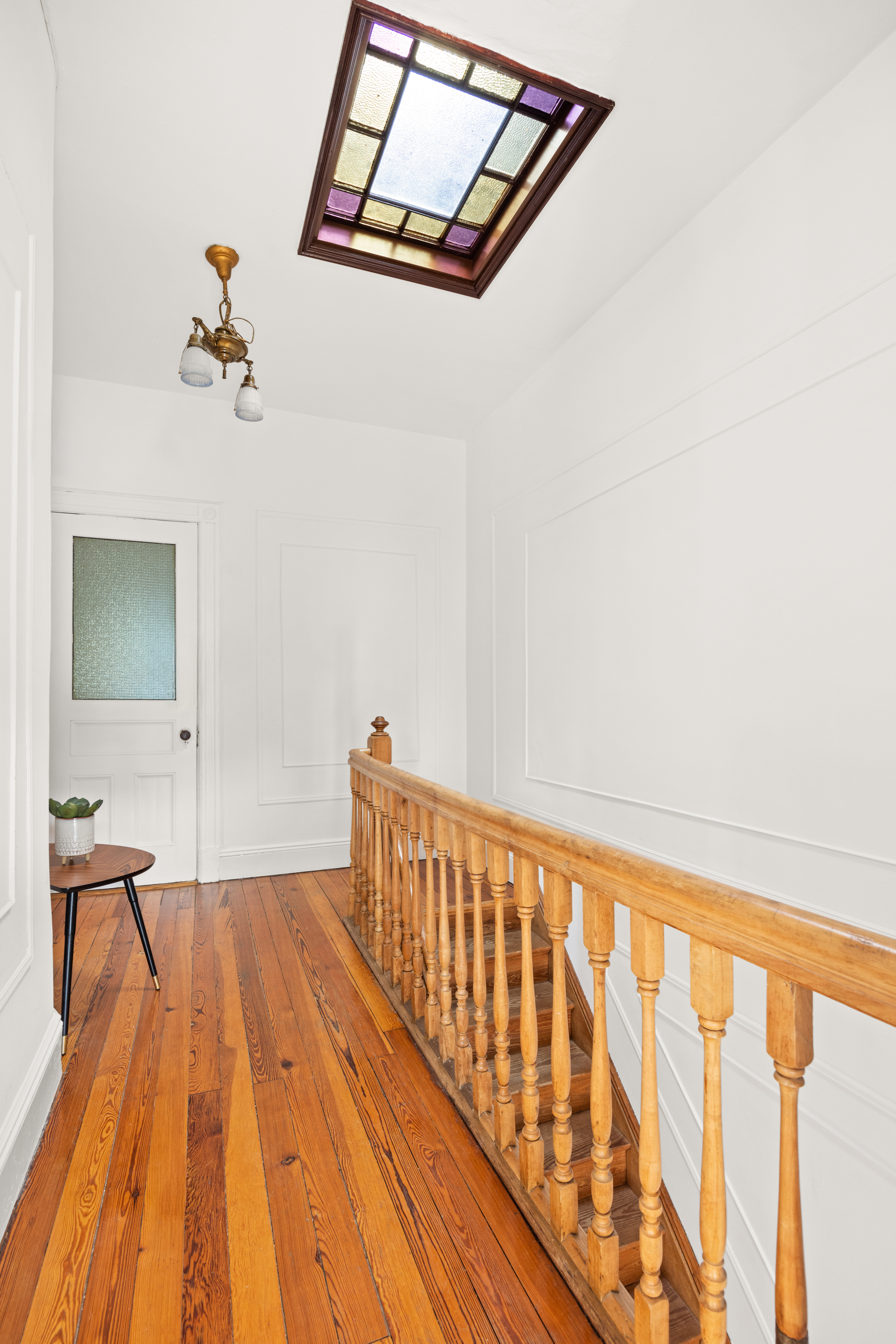 99 East 2nd Street Brooklyn, NY 11218 - Photo 18 of 24 a view of a hallway with wooden floor