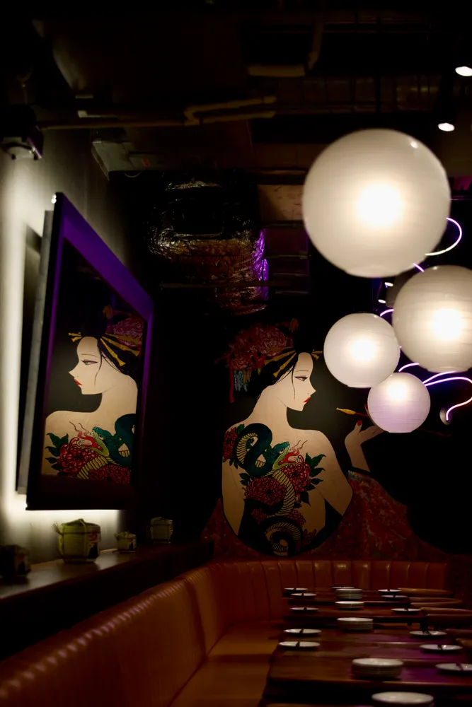 a living room with furniture and a mirror