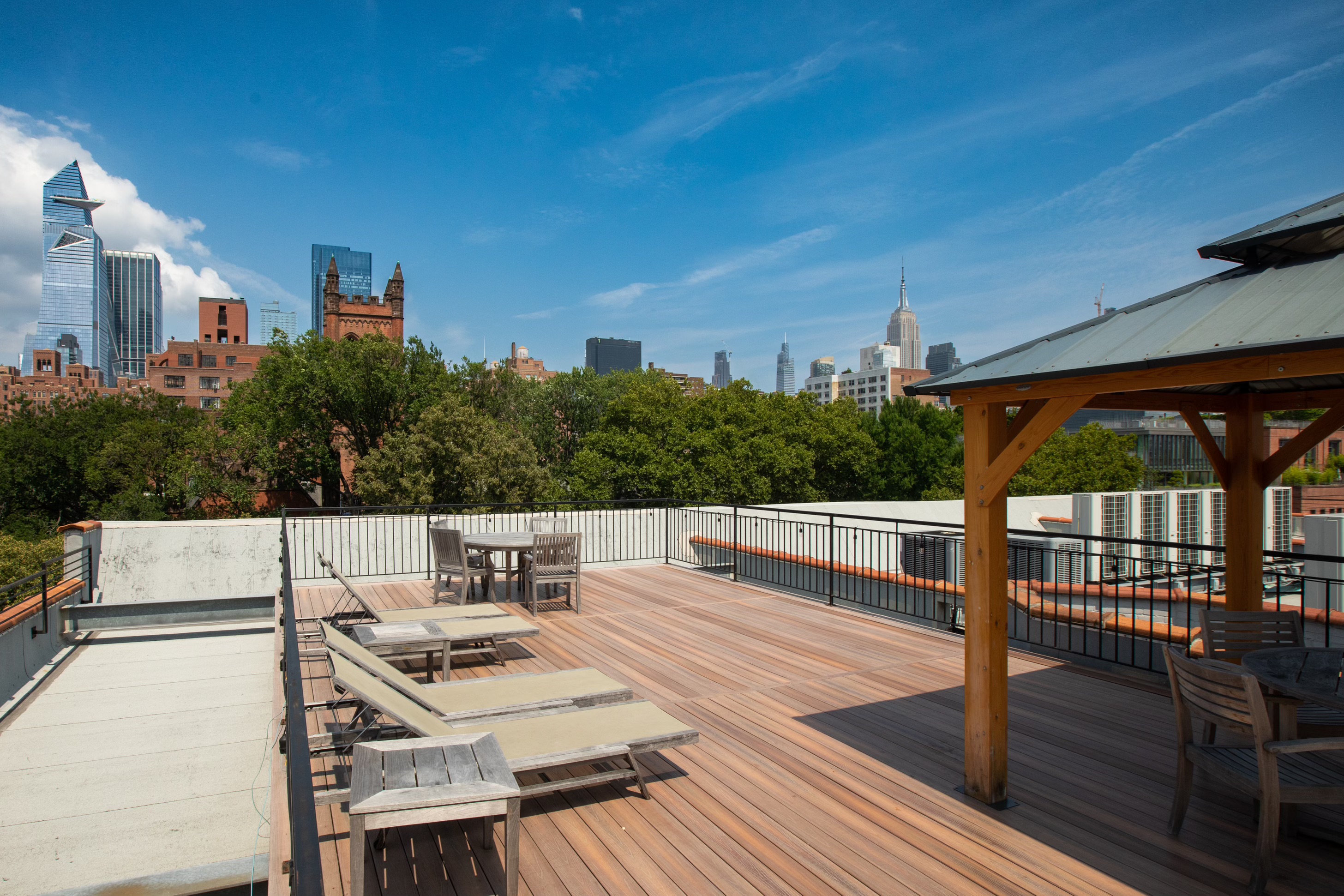 422 West 20th Street, Unit 3G Manhattan, NY 10011 - Photo 11 of 15 a view of a patio with table and chairs and potted plants