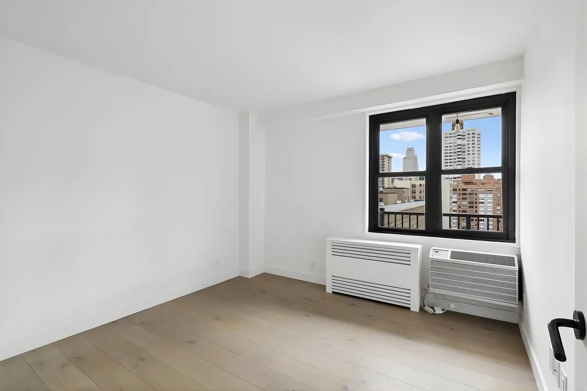 a view of an empty room with a window