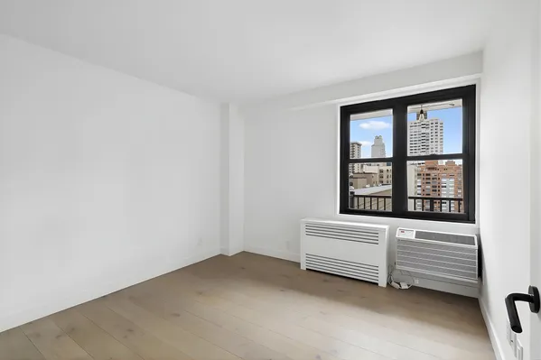 a view of an empty room with a window