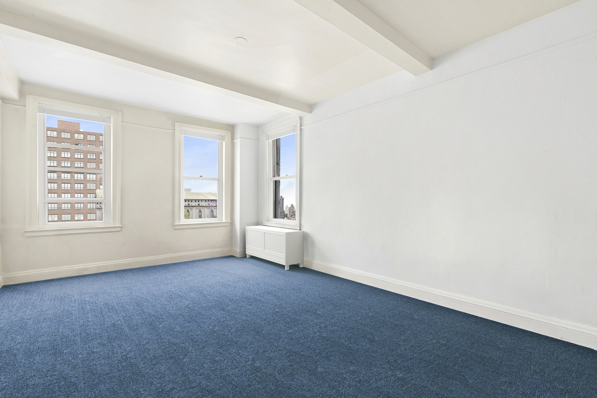 12 West 96th Street, Unit 9A Manhattan, NY 10025 - Photo 9 of 14 an empty room with windows