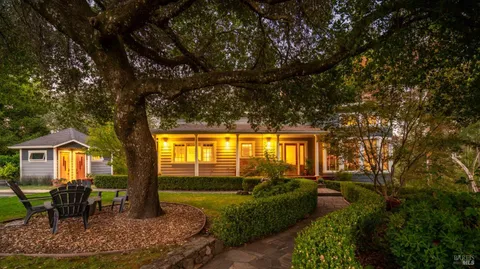 a view of backyard with seating area and green space