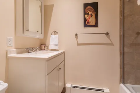 a bathroom with a sink and a mirror