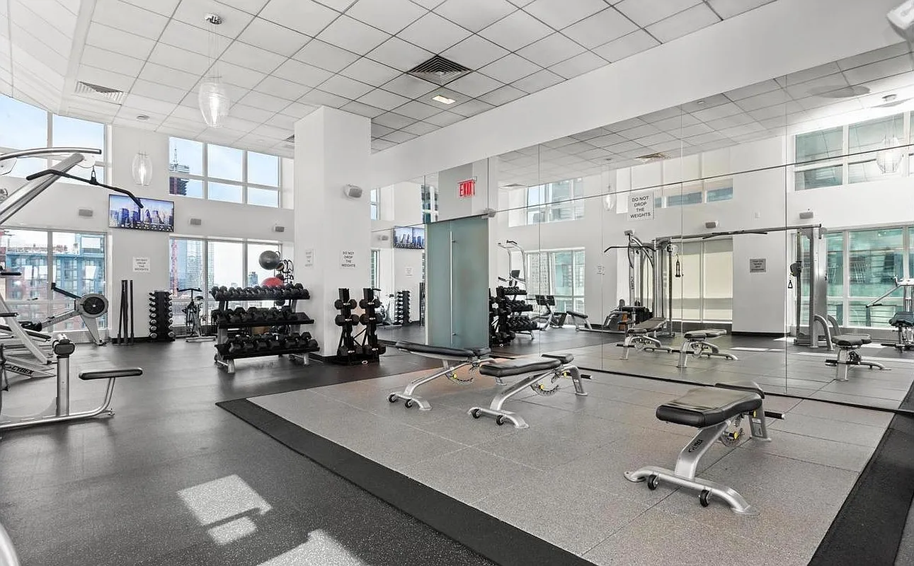 350 West 42nd Street, Unit 8H Manhattan, NY 10036 - Photo 7 of 11 a view of a gym equipment and window