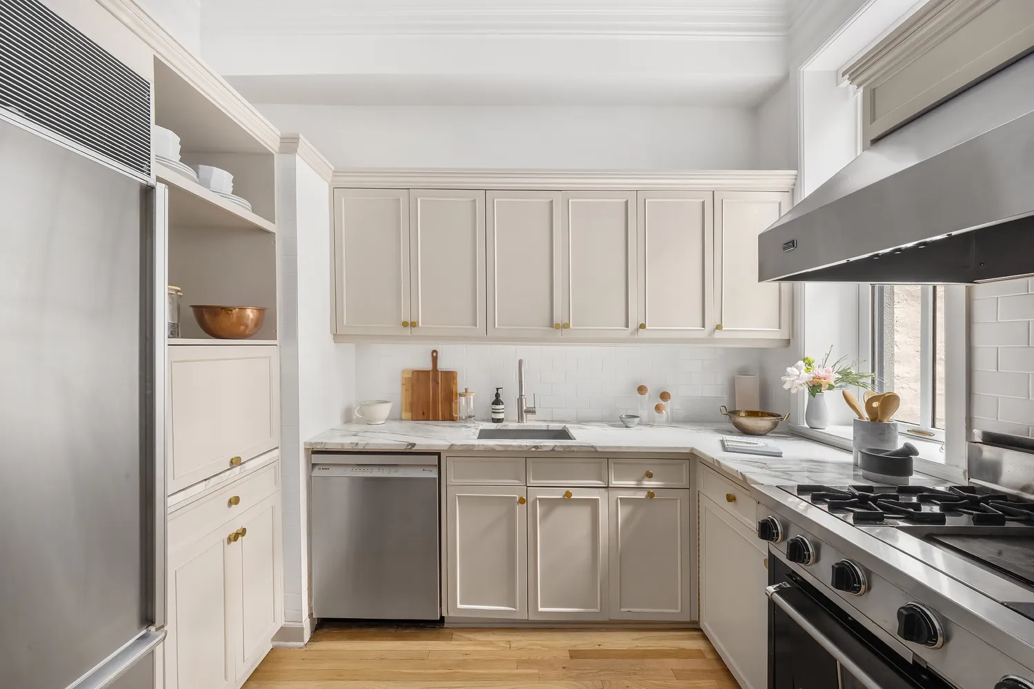 a kitchen with counter top space cabinets and stainless steel appliances