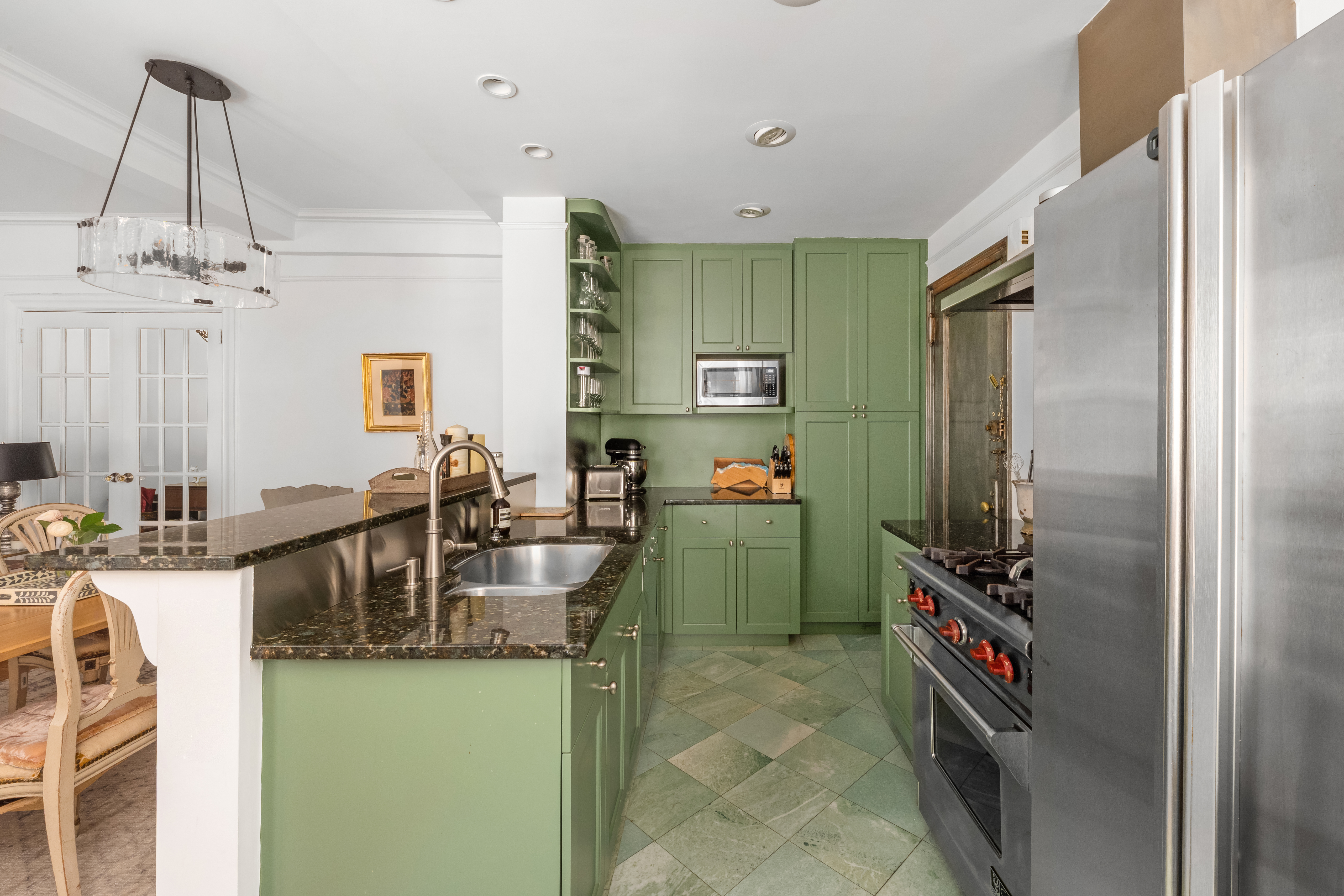 170 2nd Avenue, Unit 4A Manhattan, NY 10003 - Photo 2 of 11 a kitchen with refrigerator and cabinets