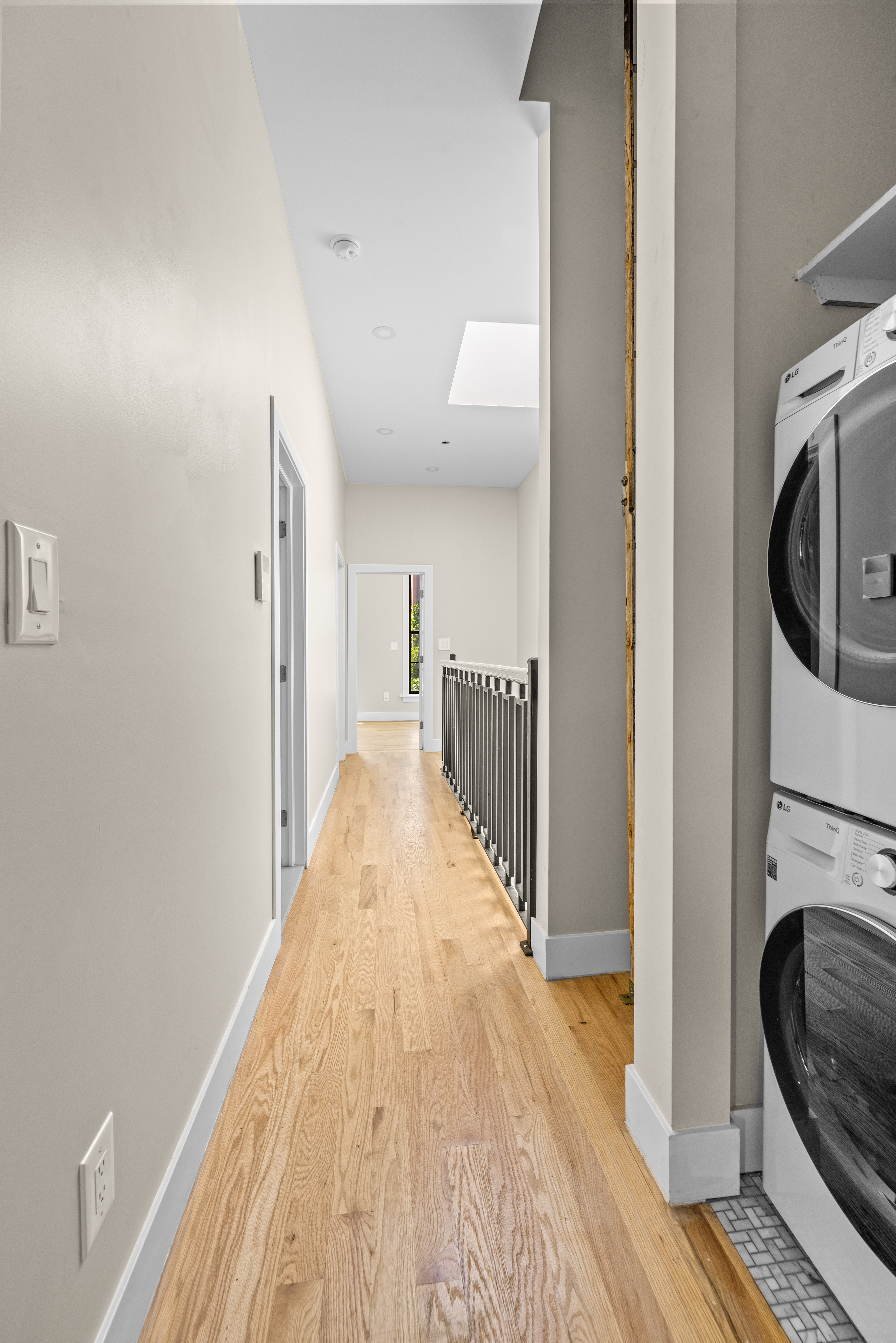 456 Willoughby Avenue, Unit 1 Brooklyn, NY 11206 - Photo 10 of 14 a view of a hallway with wooden floor and staircase