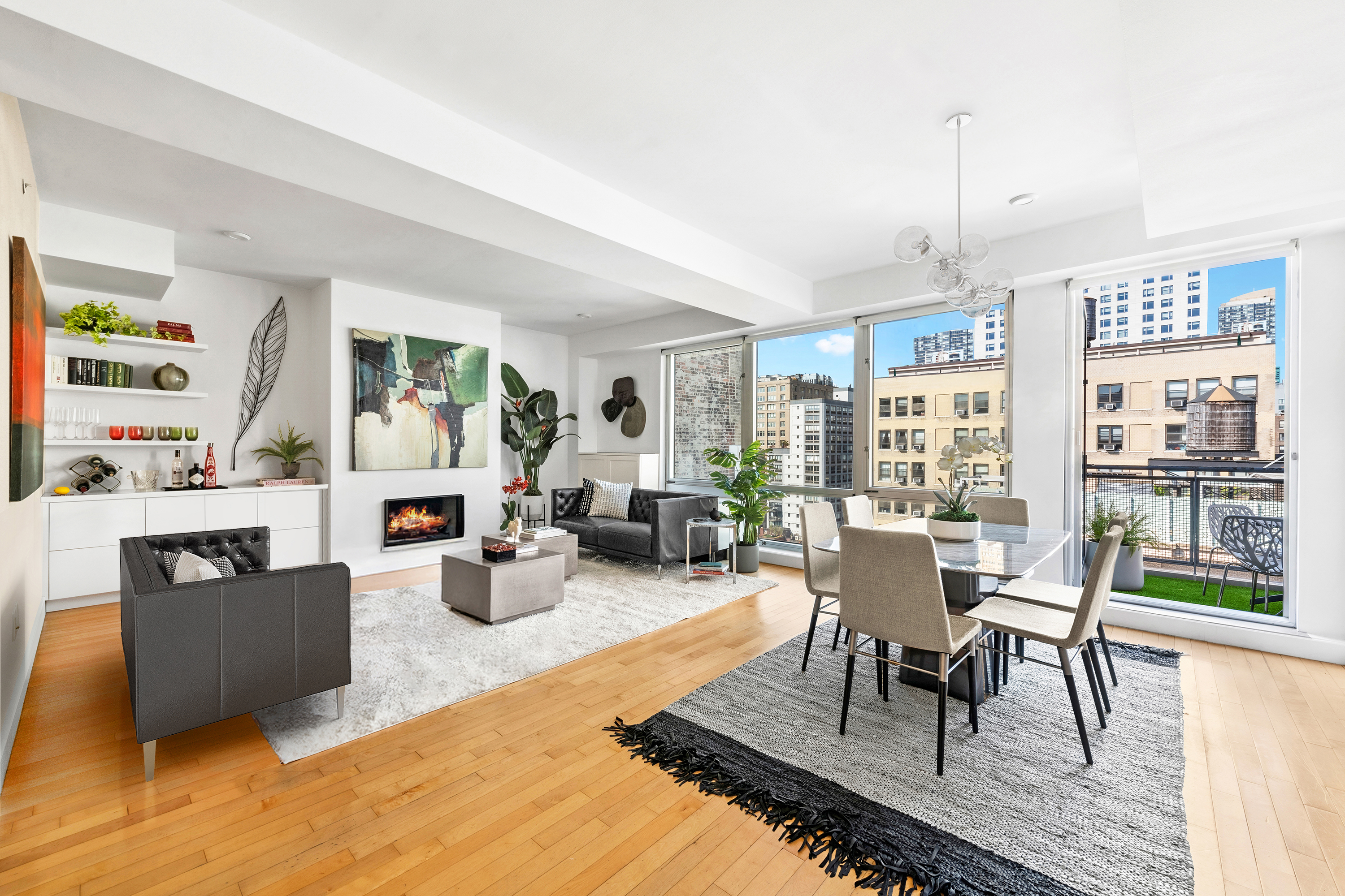 a living room with fireplace furniture and a wooden floor