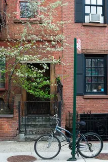 a couple of table and chairs in front of building