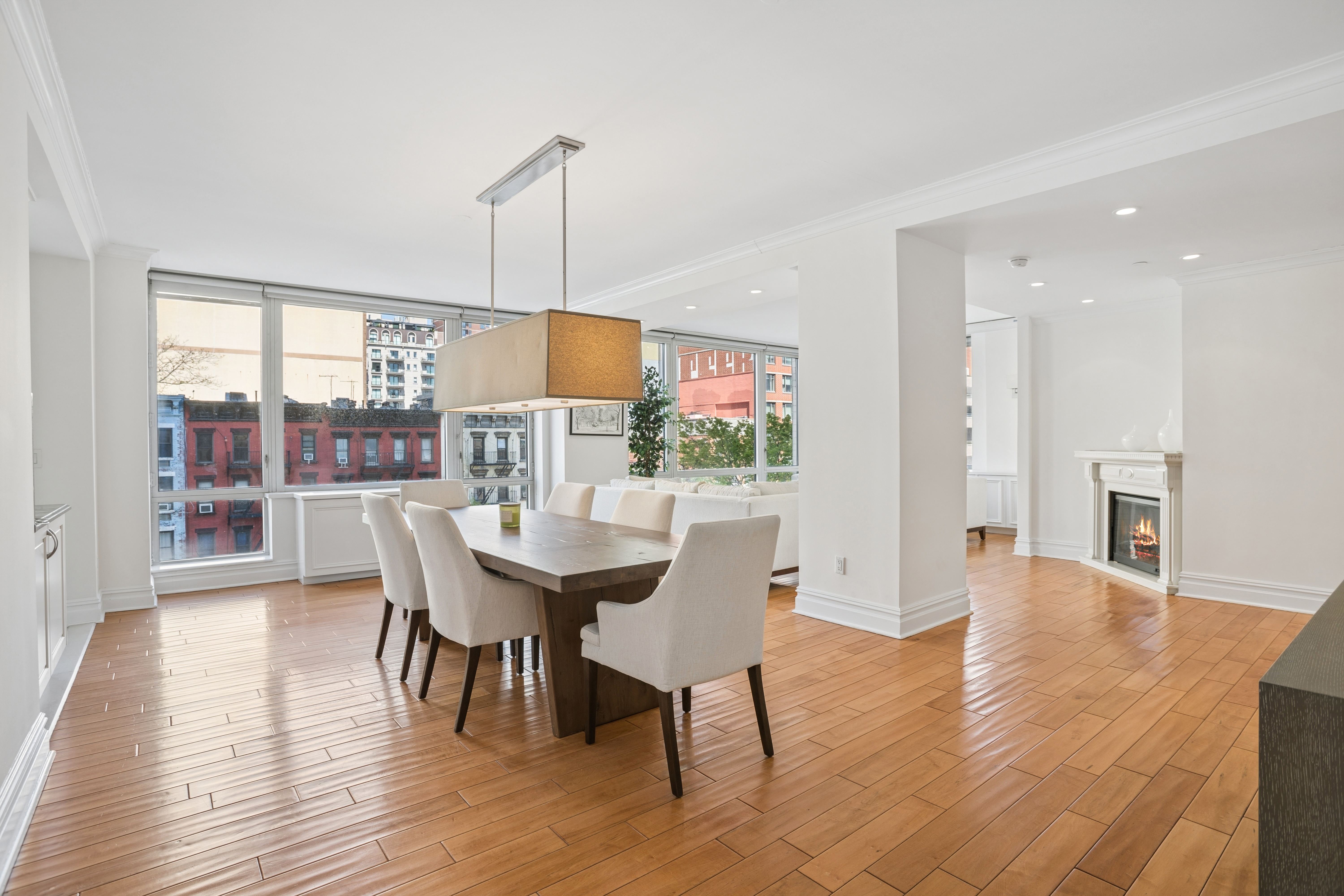 401 East 60th Street, Unit 4ABC Manhattan, NY 10022 - Photo 13 of 18 a view of a dining room with furniture window and wooden floor