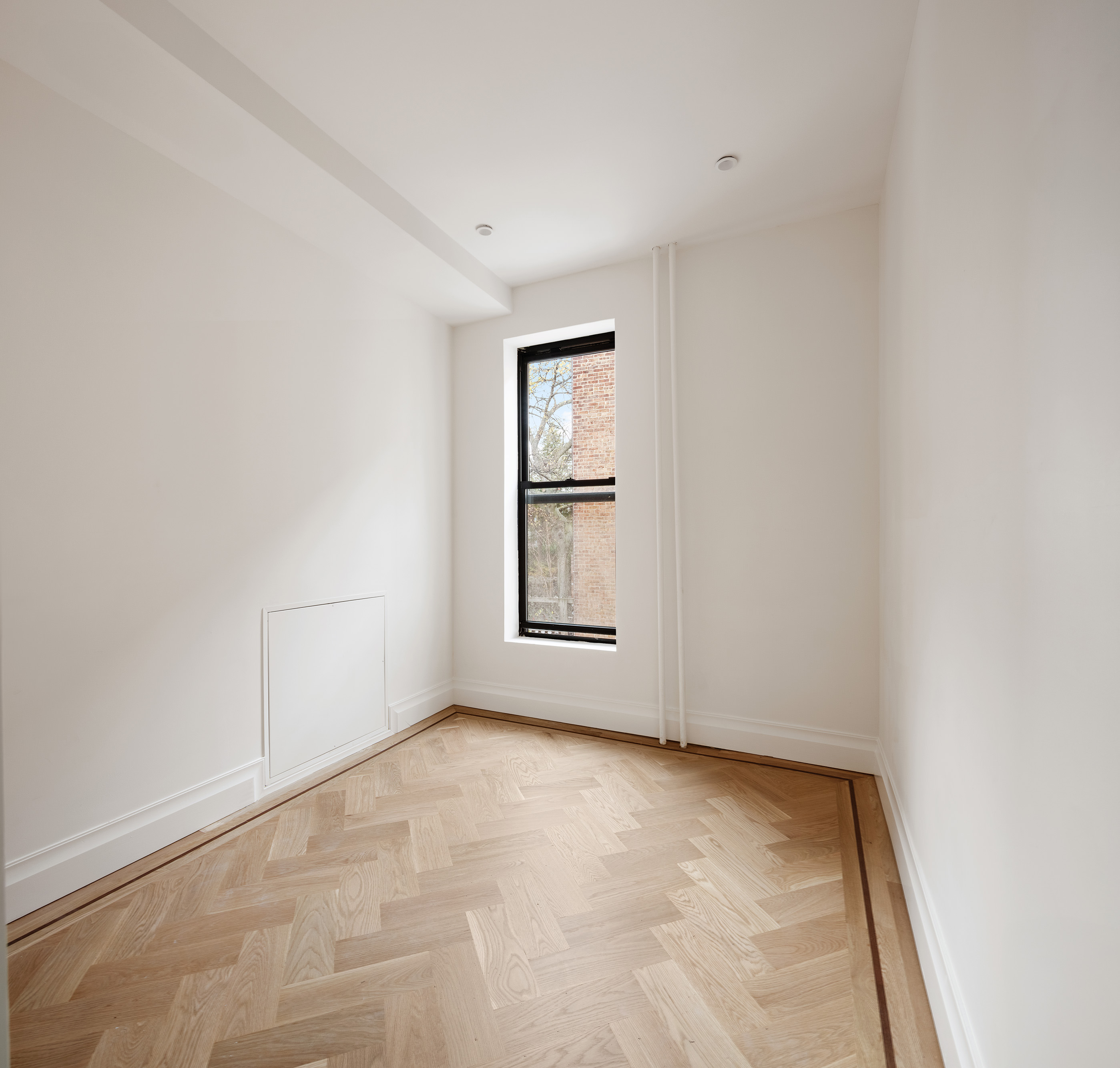80 7th Avenue, Unit 2 Brooklyn, NY 11217 - Photo 7 of 8 an empty room with windows