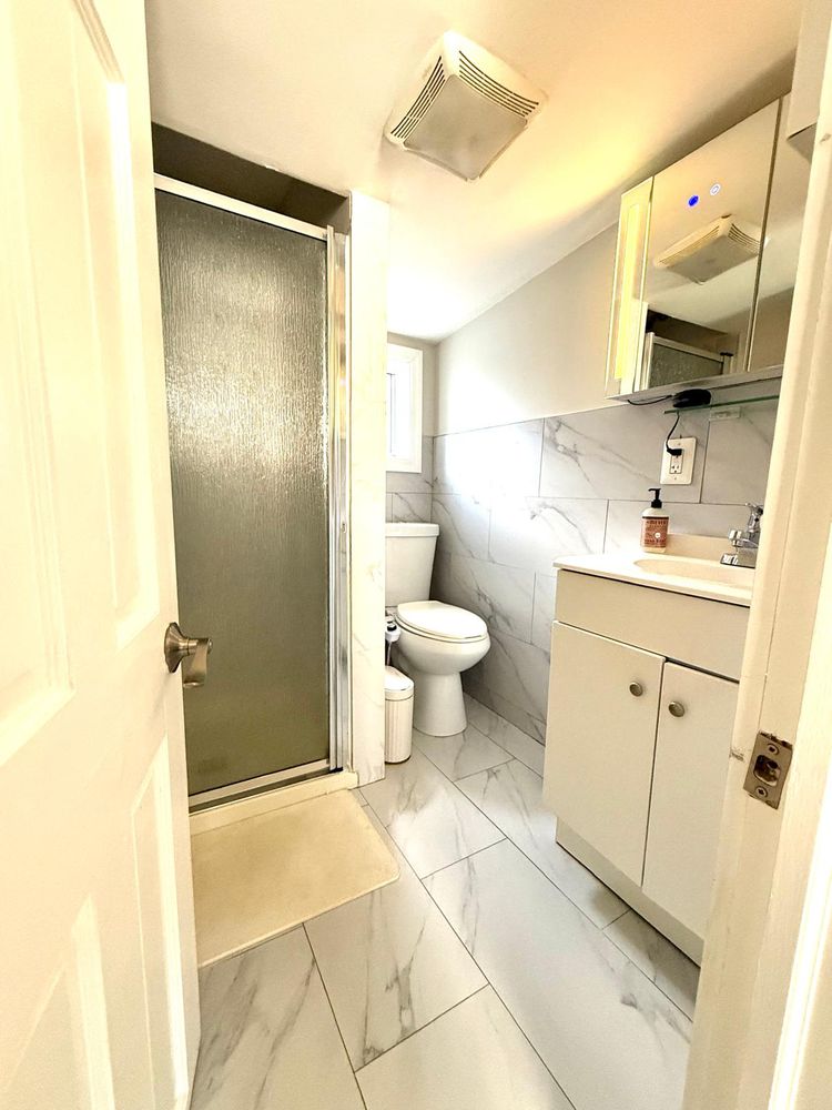 269 Ainslie Street Brooklyn, NY 11211 - Photo 17 of 22 a bathroom with a sink toilet and shower