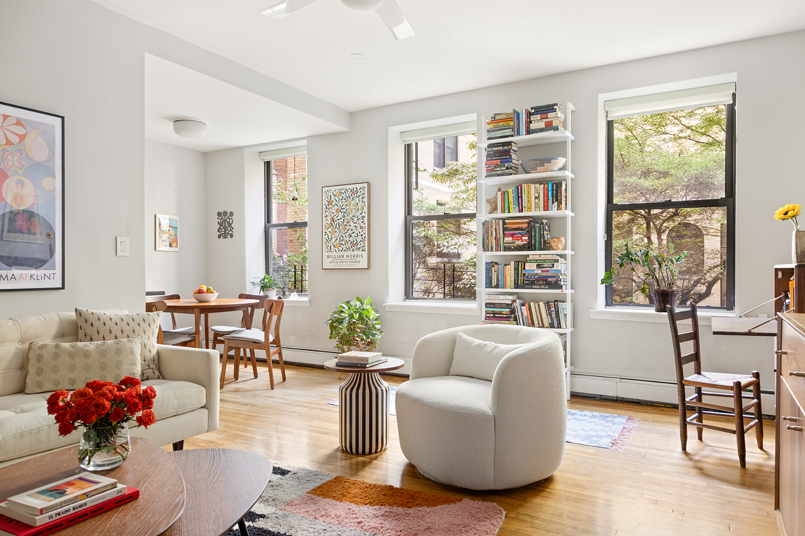 295 St Johns Place, Unit 1C Brooklyn, NY 11238 - Photo 4 of 17 a living room with furniture potted plant kitchen view and a window