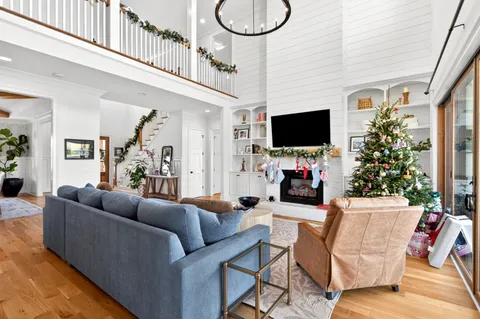 a kitchen with stainless steel appliances a stove a sink dishwasher and cabinets with wooden floor