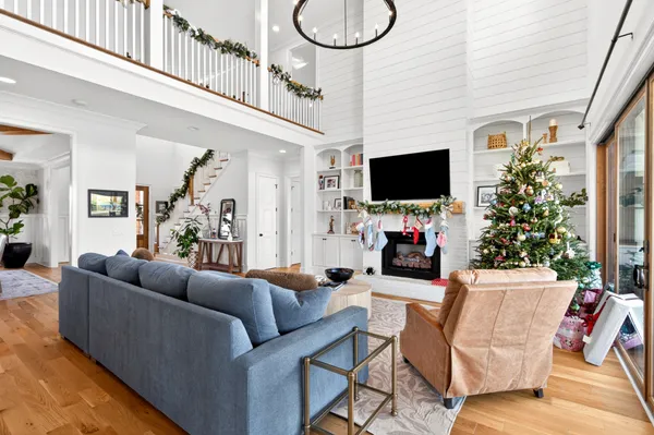 a kitchen with stainless steel appliances a stove a sink dishwasher and cabinets with wooden floor