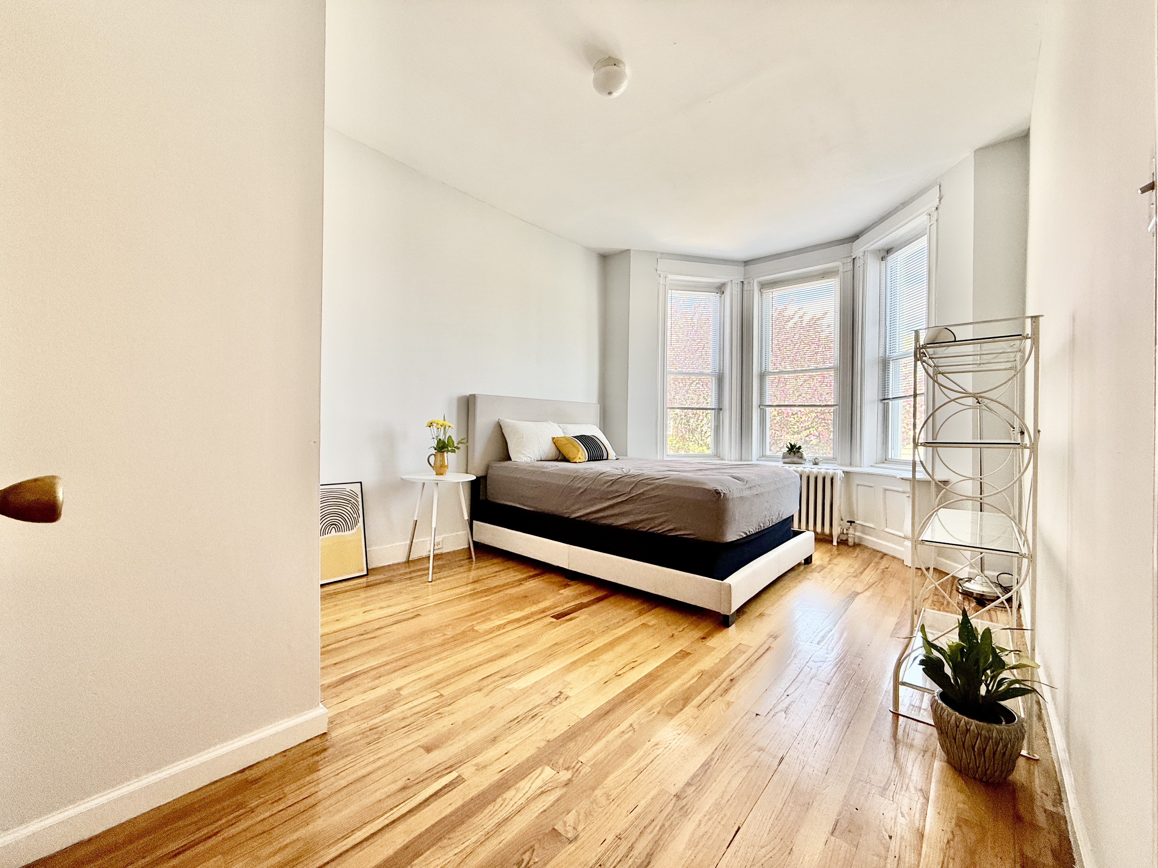 149 East 35th Street, Unit 2 Brooklyn, NY 11203 - Photo 6 of 10 a bedroom with a bed and a window