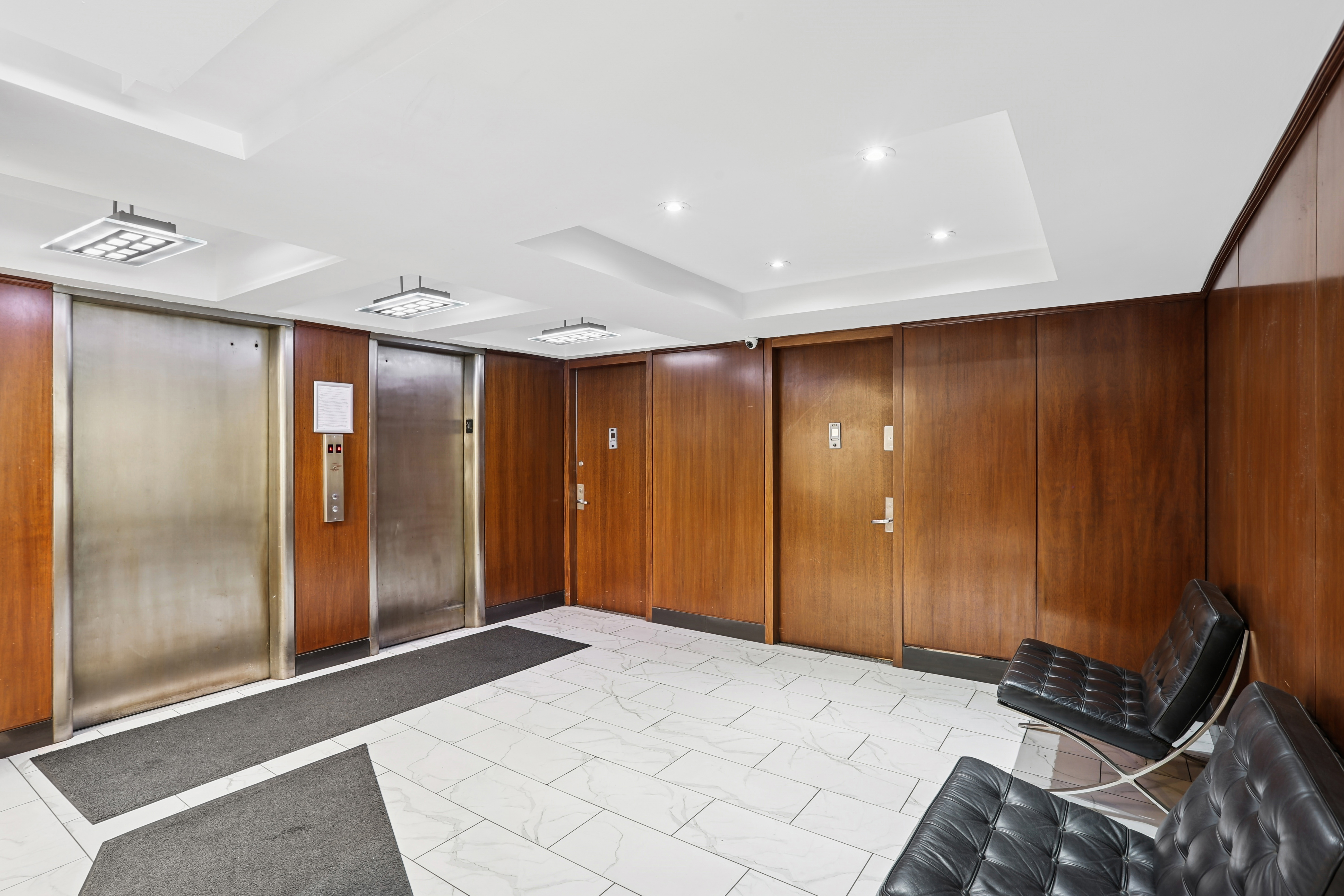 335 East 51st Street, Unit 4H Manhattan, NY 10022 - Photo 11 of 13 a bedroom with a large bed and a shower