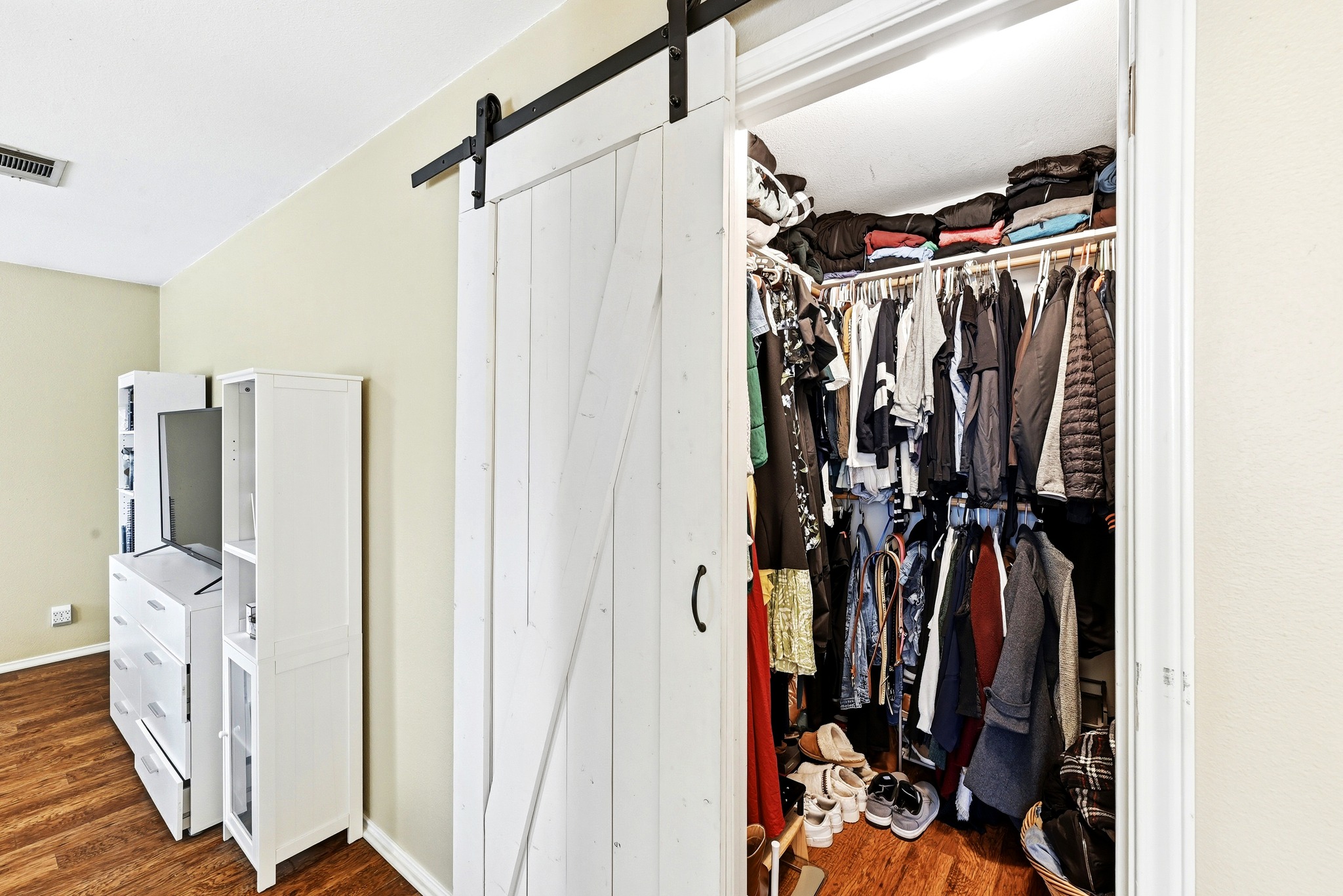 8901 Frock Court Austin, TX 78748 - Photo 20 of 28 a view of walk in closet with clothes and shoes