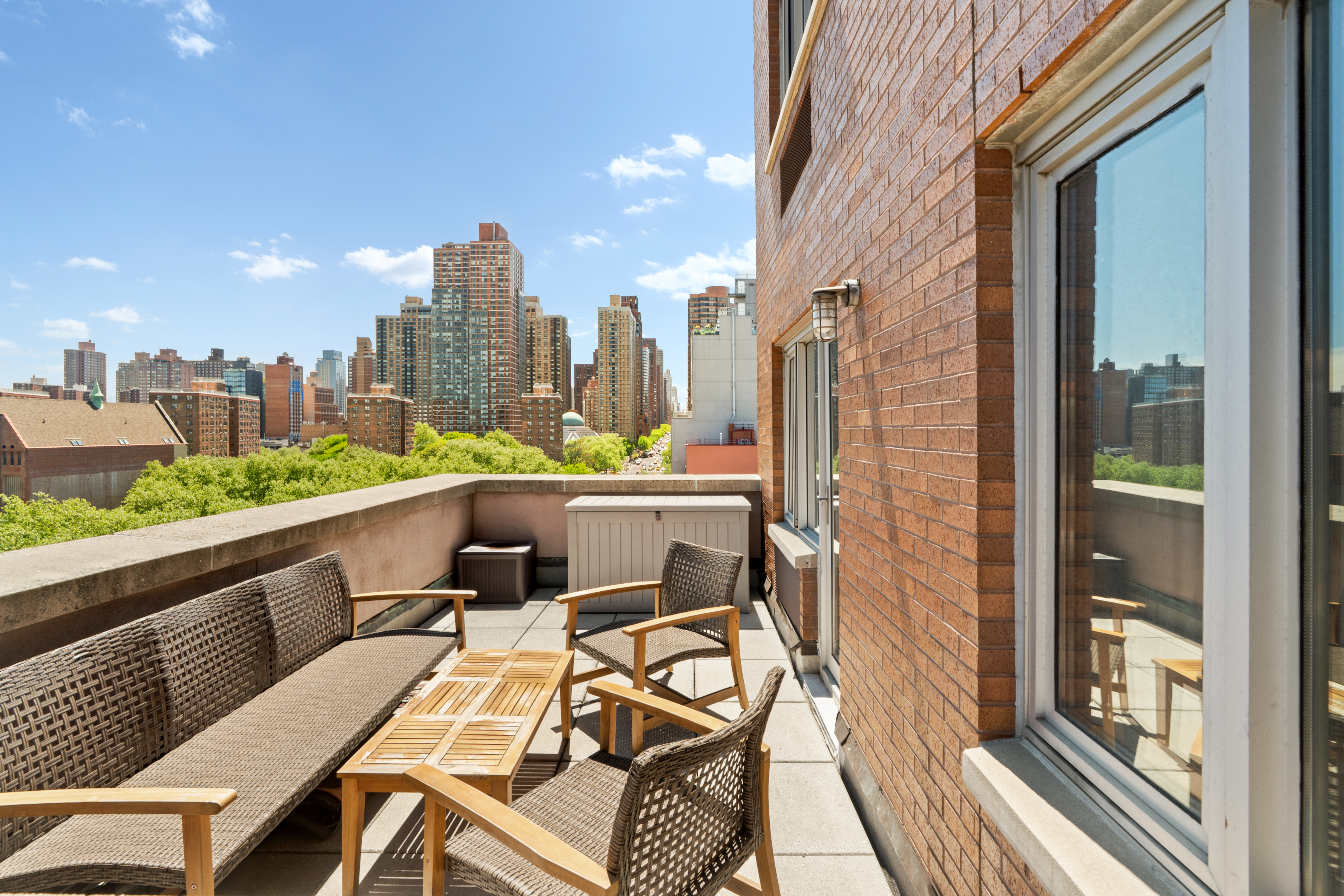 1810 3rd Avenue, Unit 9D Manhattan, NY 10029 - Photo 1 of 10 a terrace with outdoor seating and city view