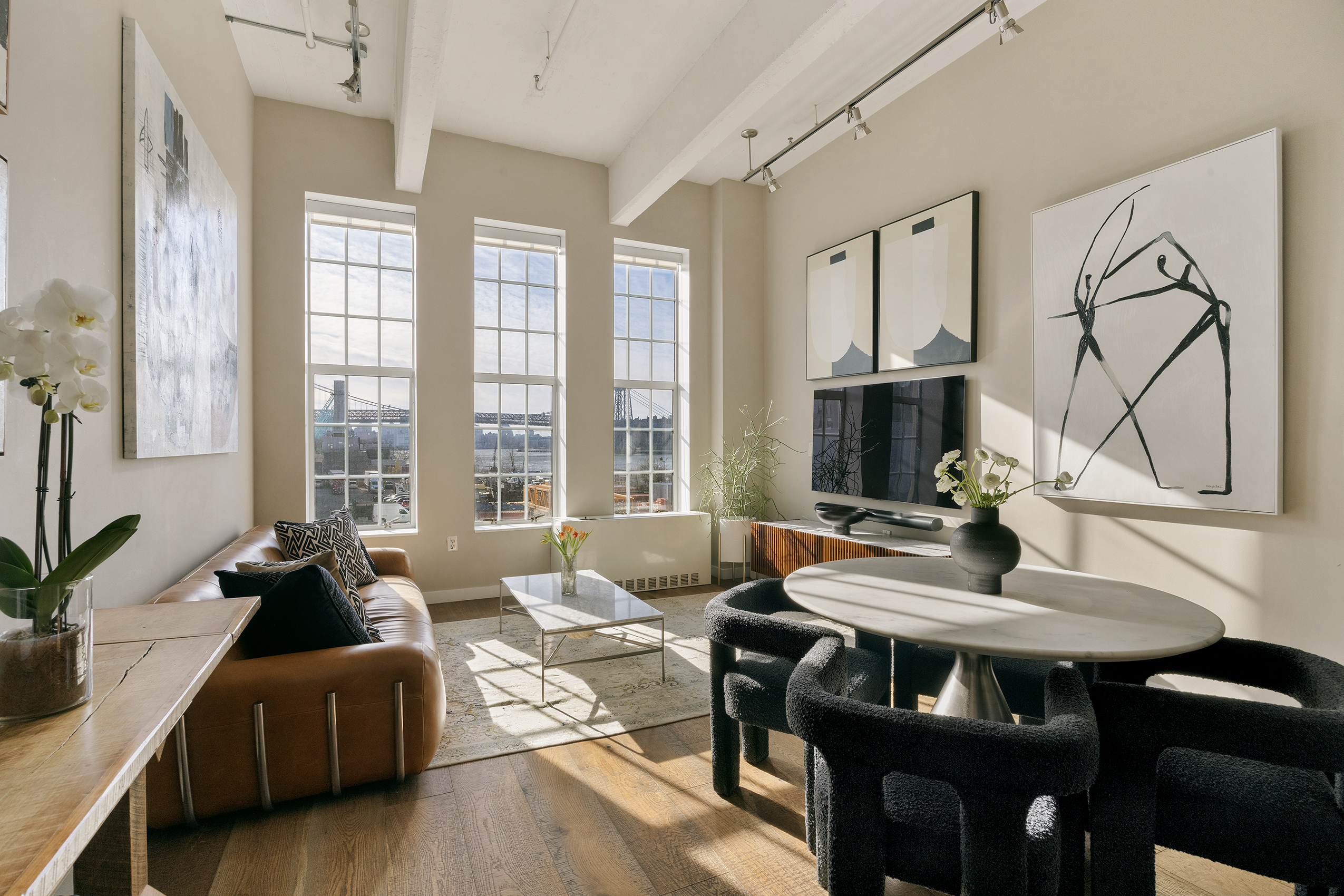 184 Kent Avenue, Unit B305 Brooklyn, NY 11249 - Photo 8 of 15 a living room with furniture and a window