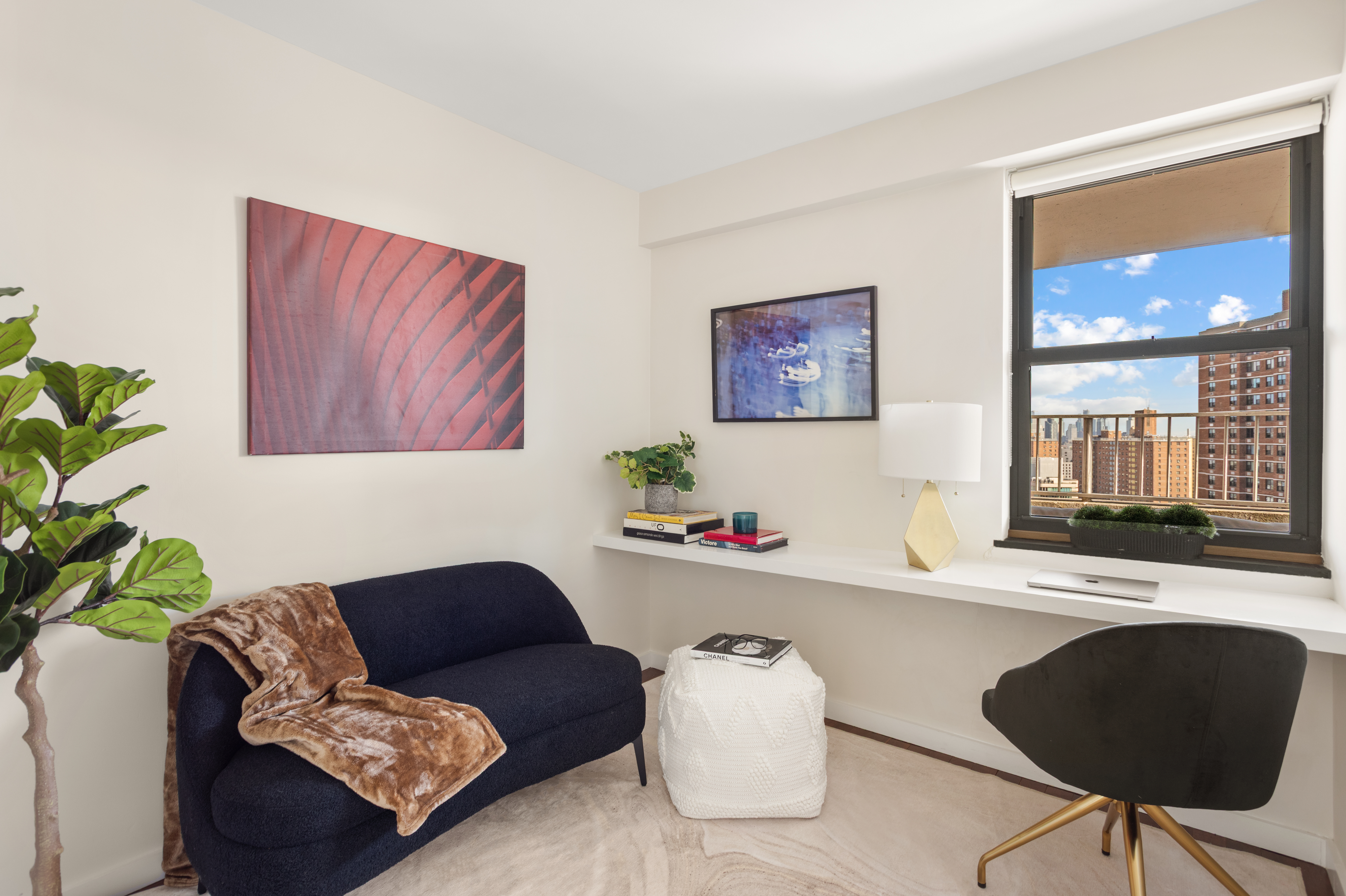 417 Grand Street, Unit D1801 Manhattan, NY 10002 - Photo 9 of 23 a living room with furniture and a potted plant