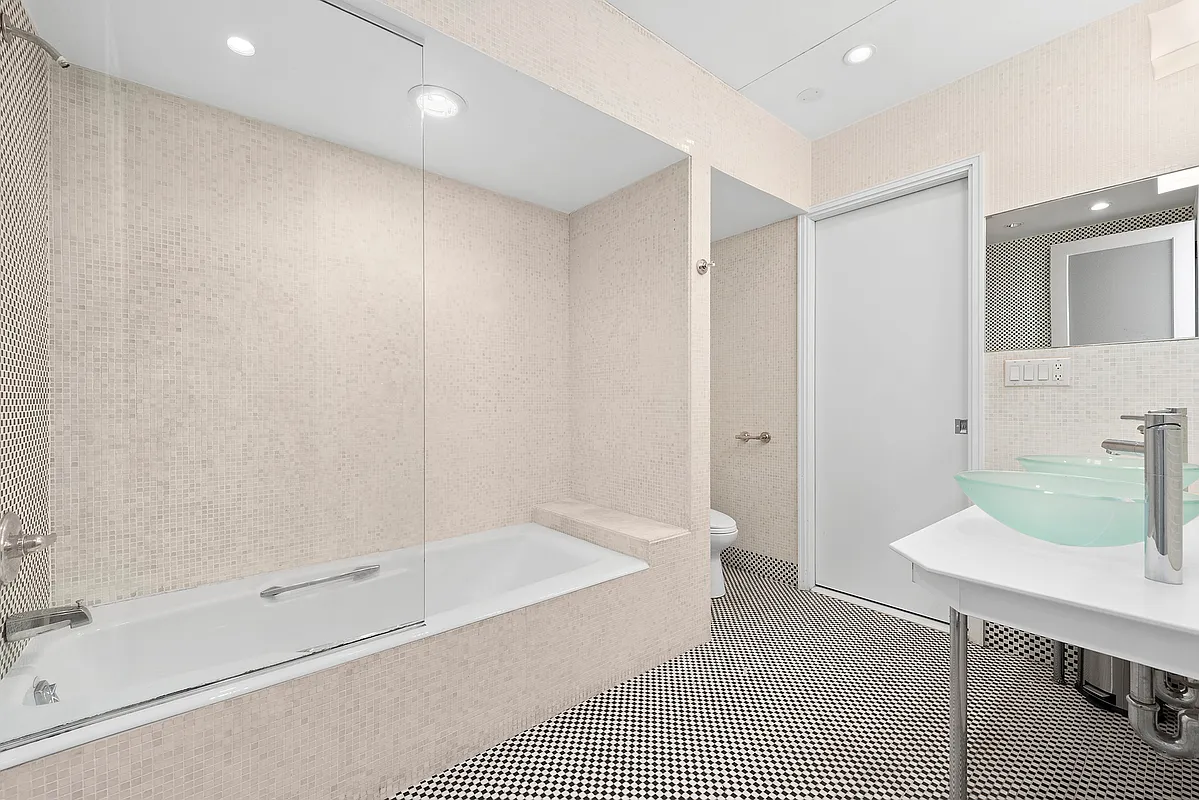 53 Murray Street, Unit G Manhattan, NY 10007 - Photo 8 of 12 a bathroom with a bathtub and a sink