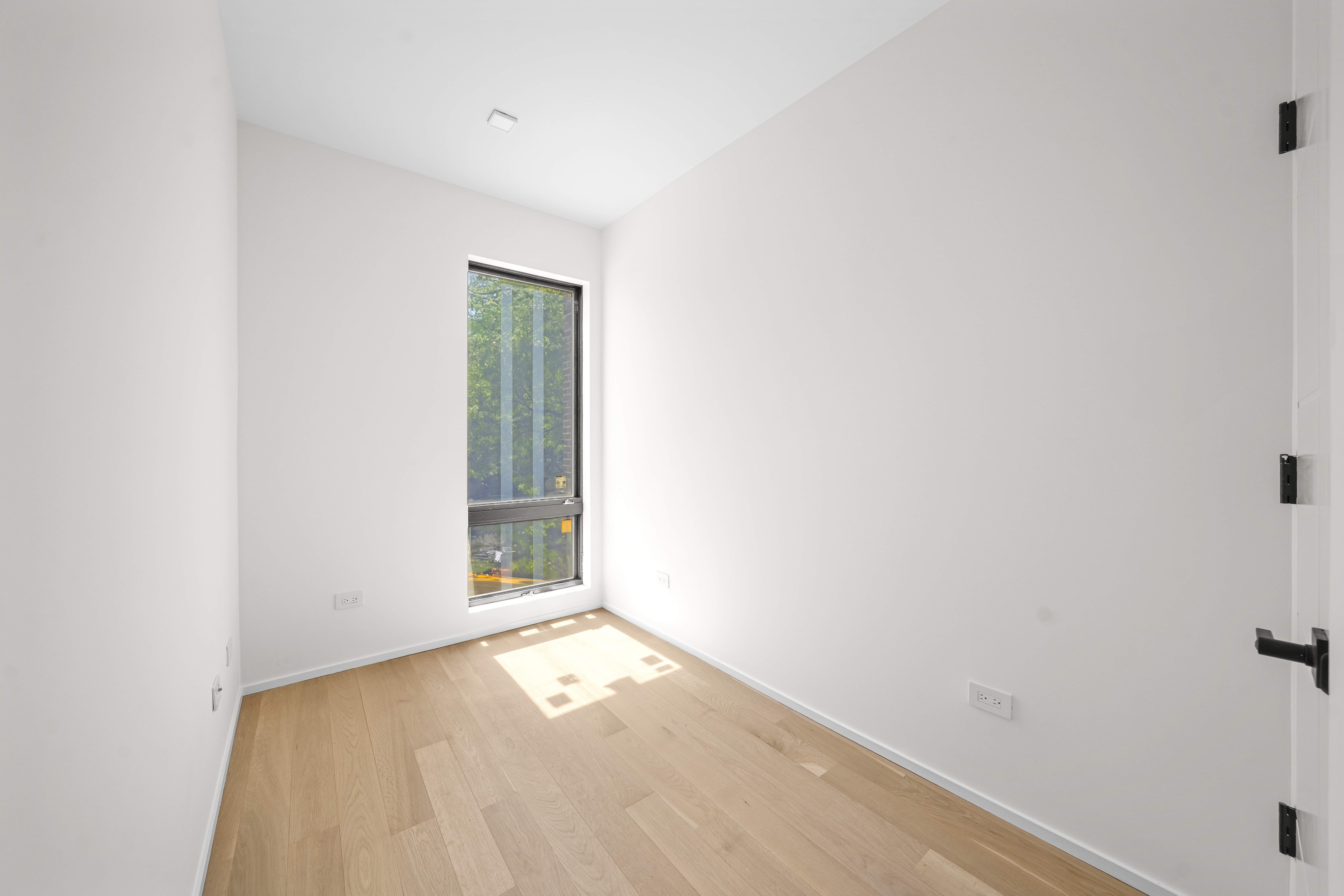 953 St Nicholas Avenue, Unit 1 Manhattan, NY 10032 - Photo 7 of 15 a view of an empty room and window