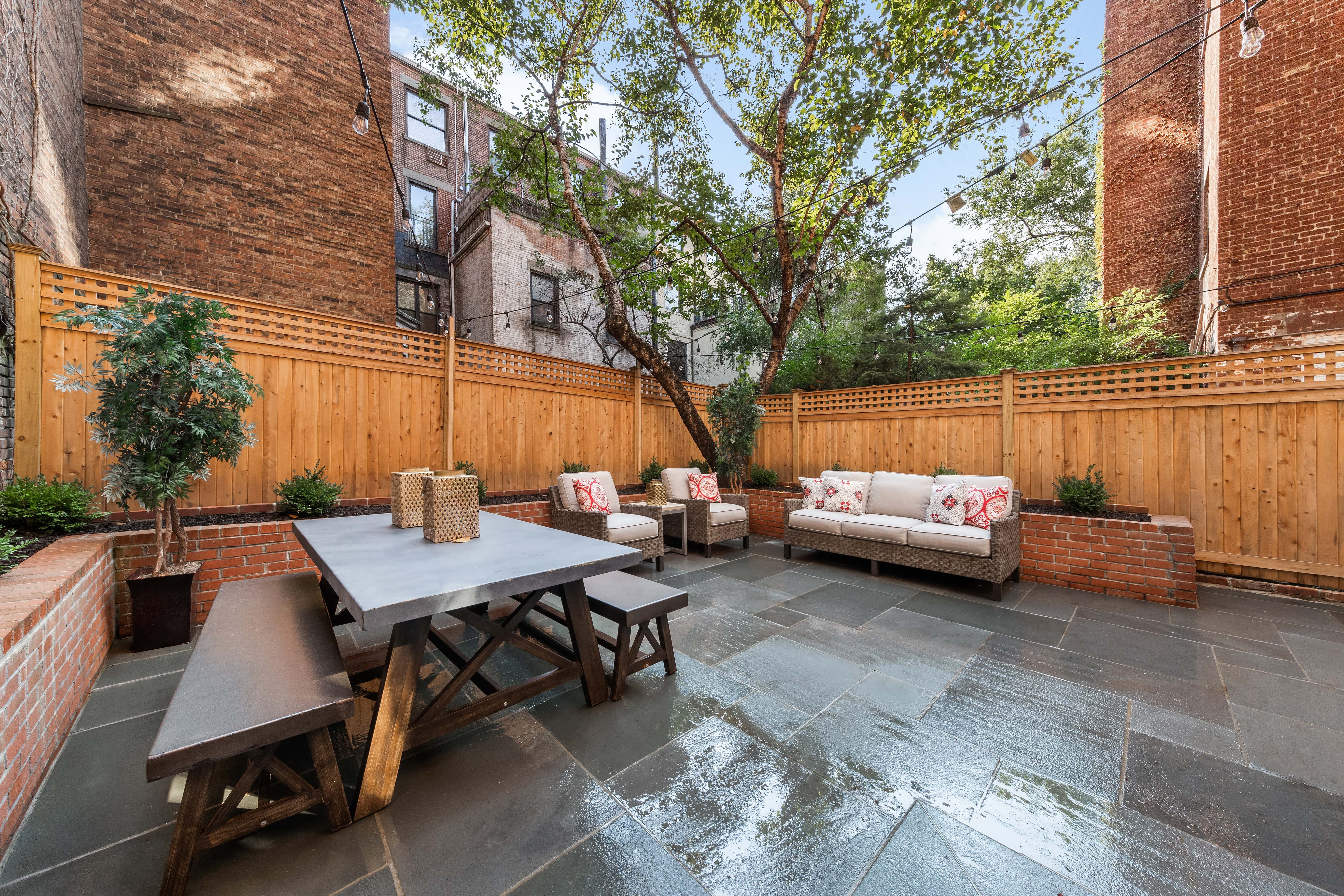 110 West 81st Street Manhattan, NY 10024 - Photo 6 of 30 a view of a patio with a table and chairs and couches
