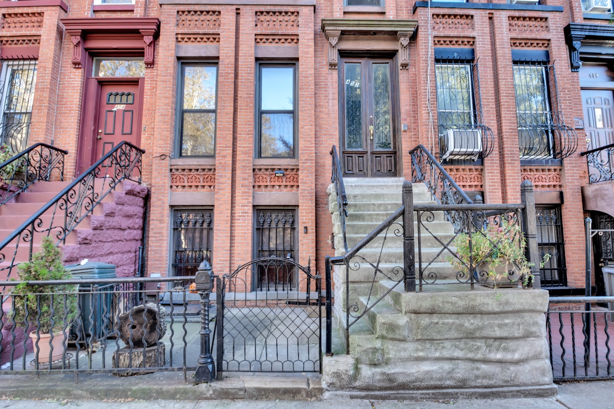 452 MacDonough Street, Unit 3 Brooklyn, NY 11233 - Photo 6 of 7 a front view of a building with a street