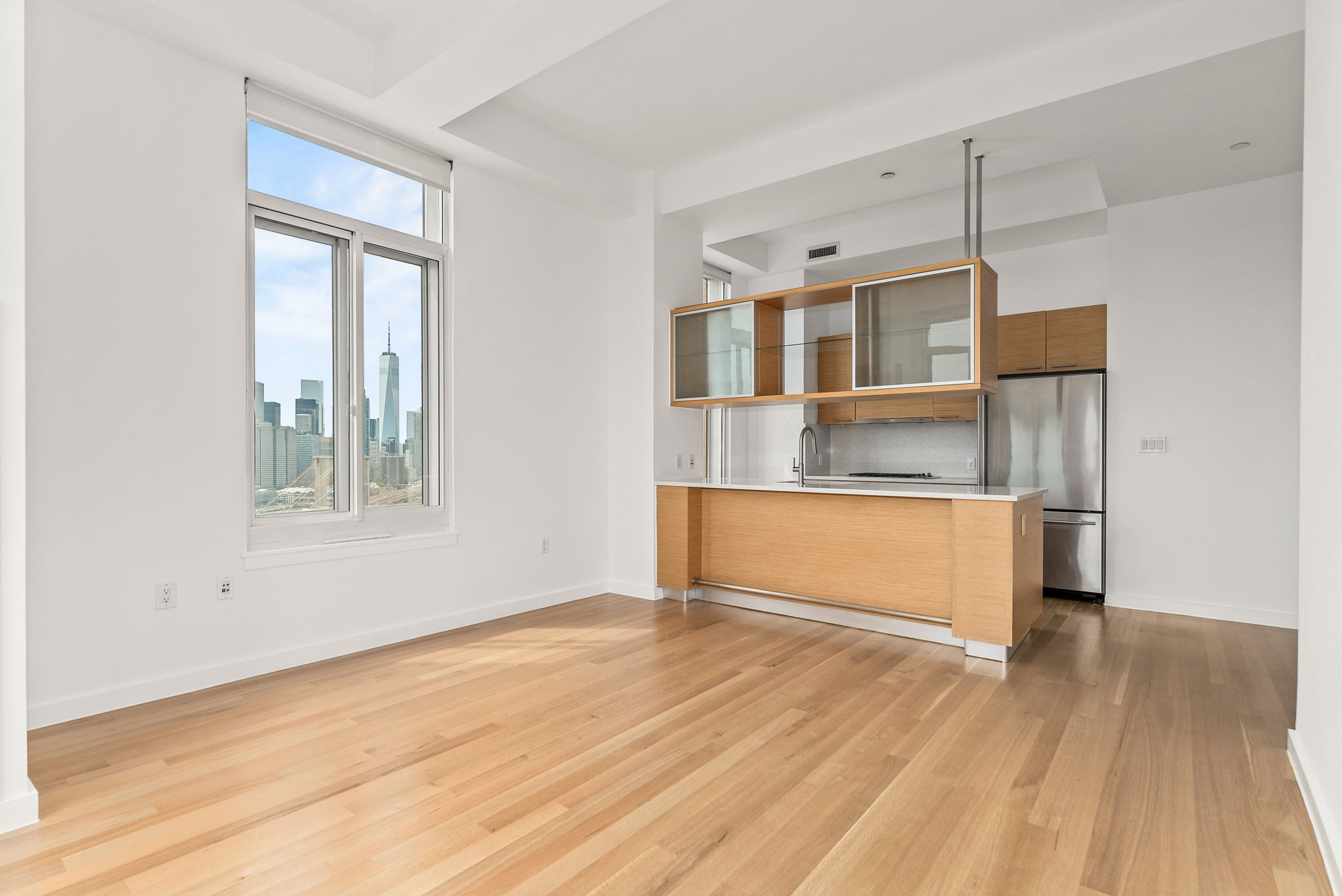 85 Adams Street, Unit 21A Brooklyn, NY 11201 - Photo 4 of 18 a living room with a wooden floor