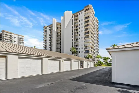 a kitchen with a table a sink cabinets and appliances