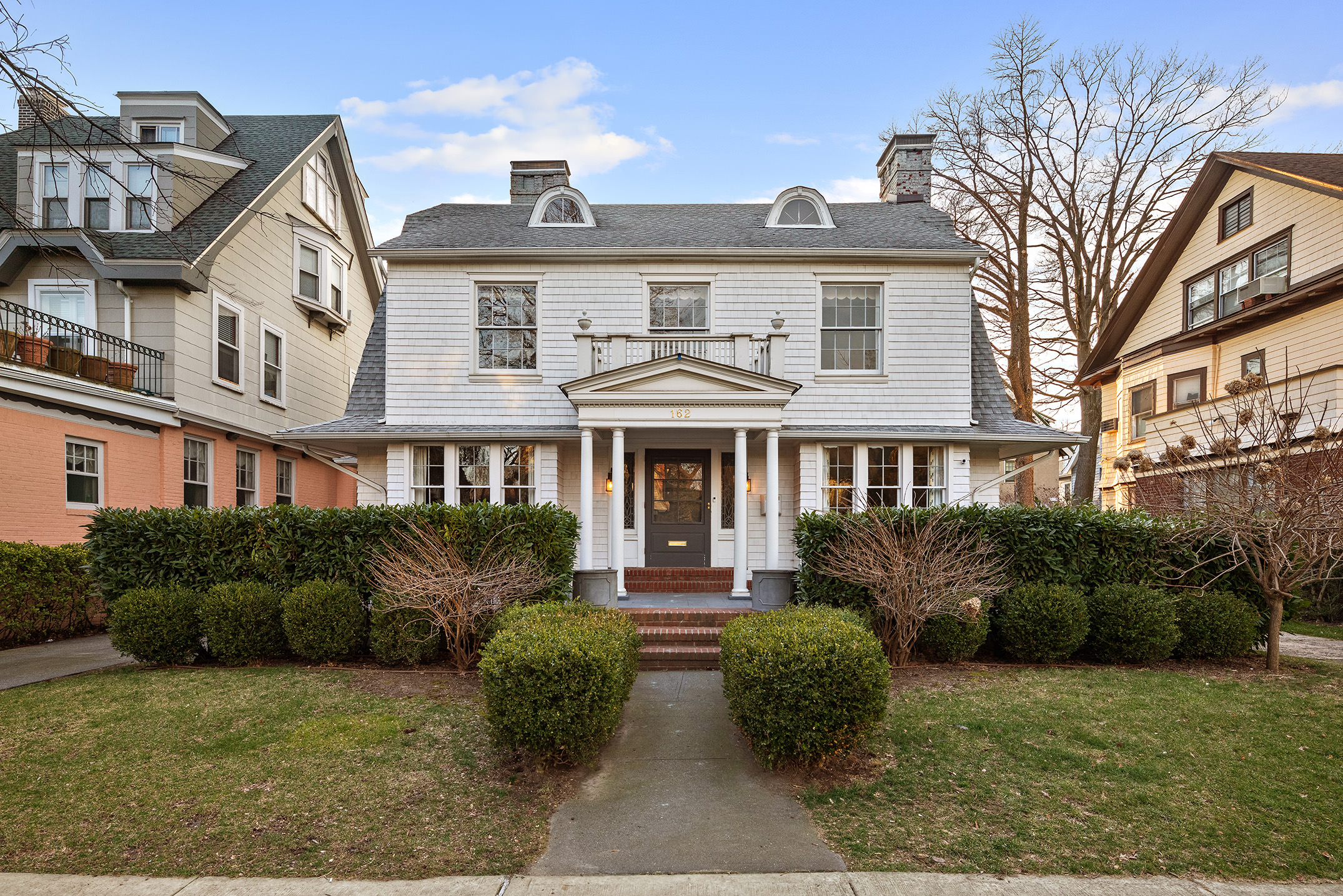 162 Argyle Road Brooklyn, NY 11218 - Photo 24 of 25 a front view of a residential apartment building with a yard