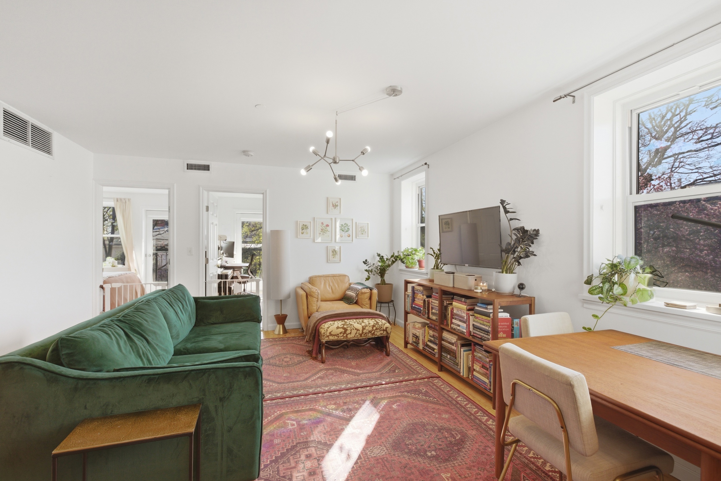 392 11th Street, Unit 3A Brooklyn, NY 11215 - Photo 2 of 11 a living room with furniture and a flat screen tv