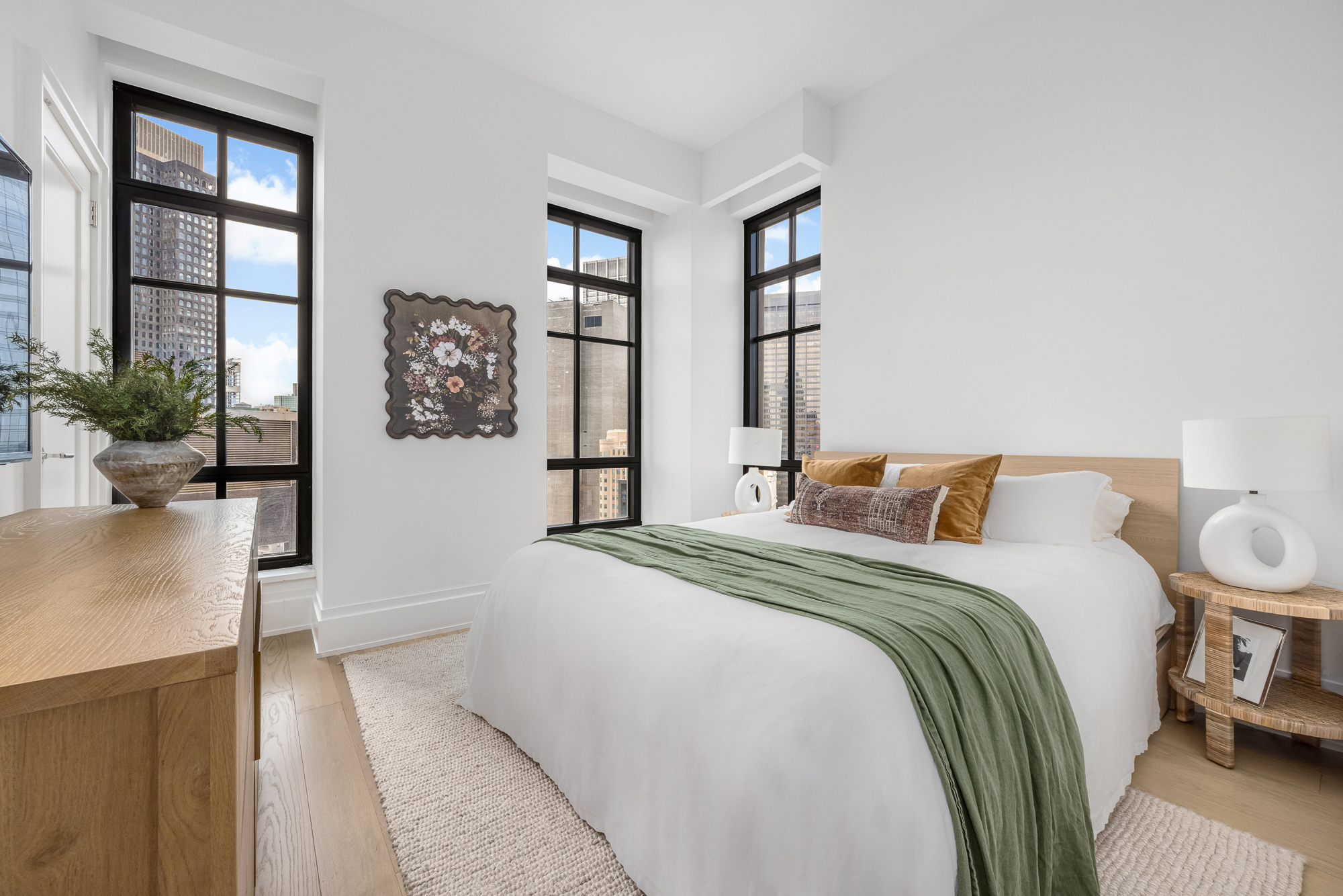 25 Park Row, Unit 29A Manhattan, NY 10038 - Photo 14 of 23 a spacious bedroom with a bed and a window