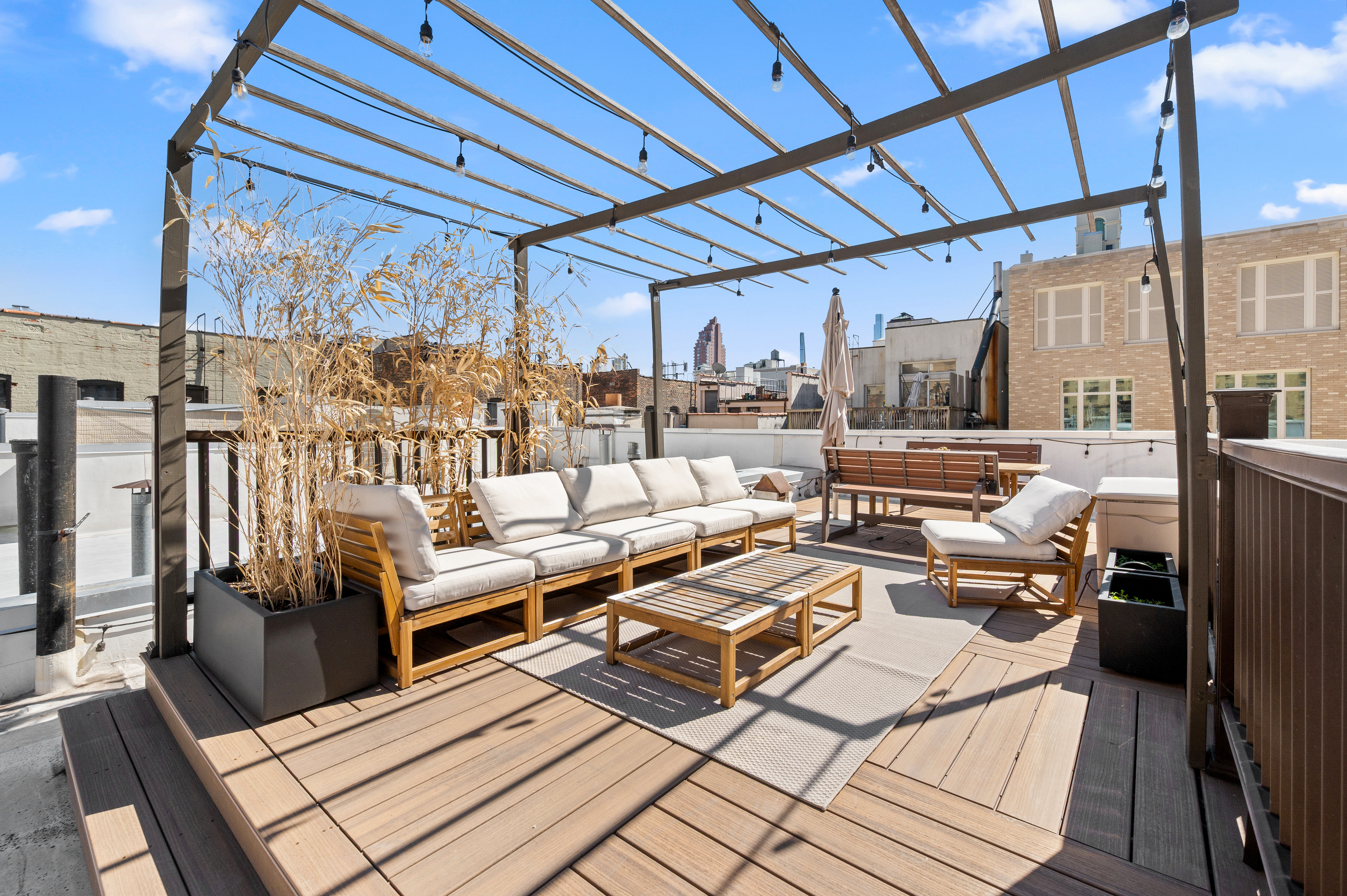 206 West 85th Street, Unit 5 Manhattan, NY 10024 - Photo 13 of 15 a view of a patio with couches chairs and wooden floor
