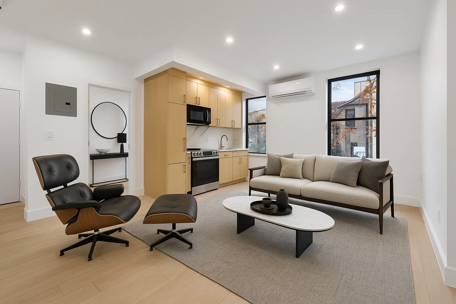 204 Flatbush Avenue, Unit 2L Brooklyn, NY 11217 - Photo 1 of 9 a living room with furniture a rug and white walls
